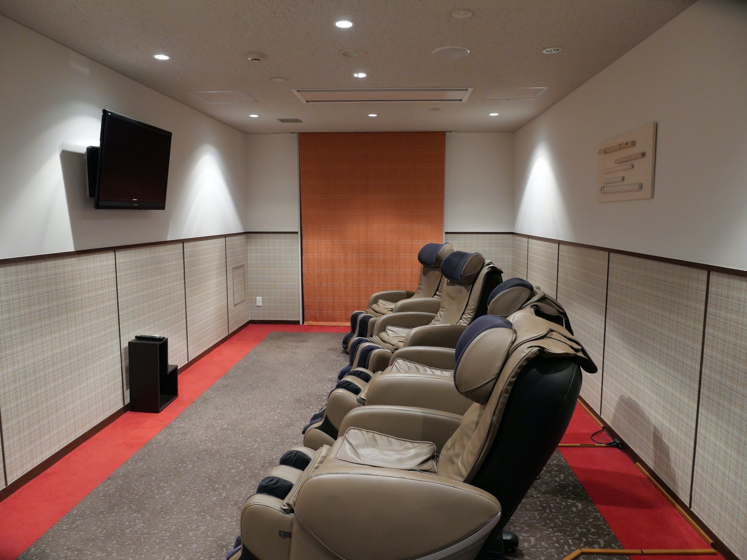 A row of massage chairs.