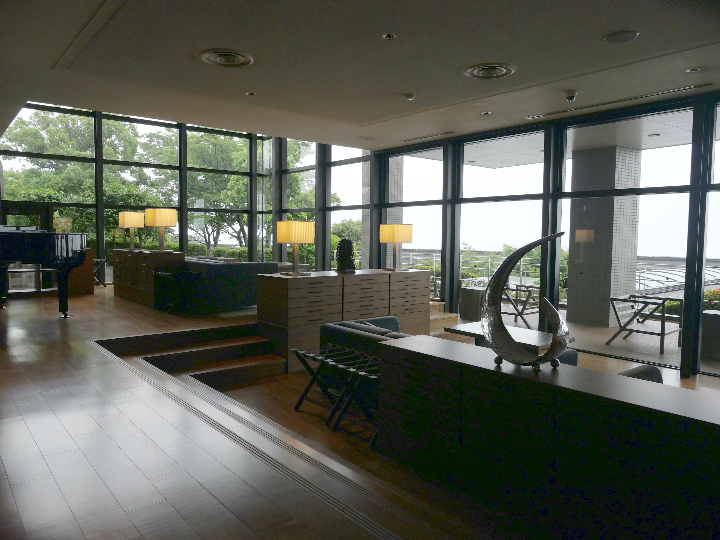 A sculpted crescent in the lobby, with the terrace beyond.