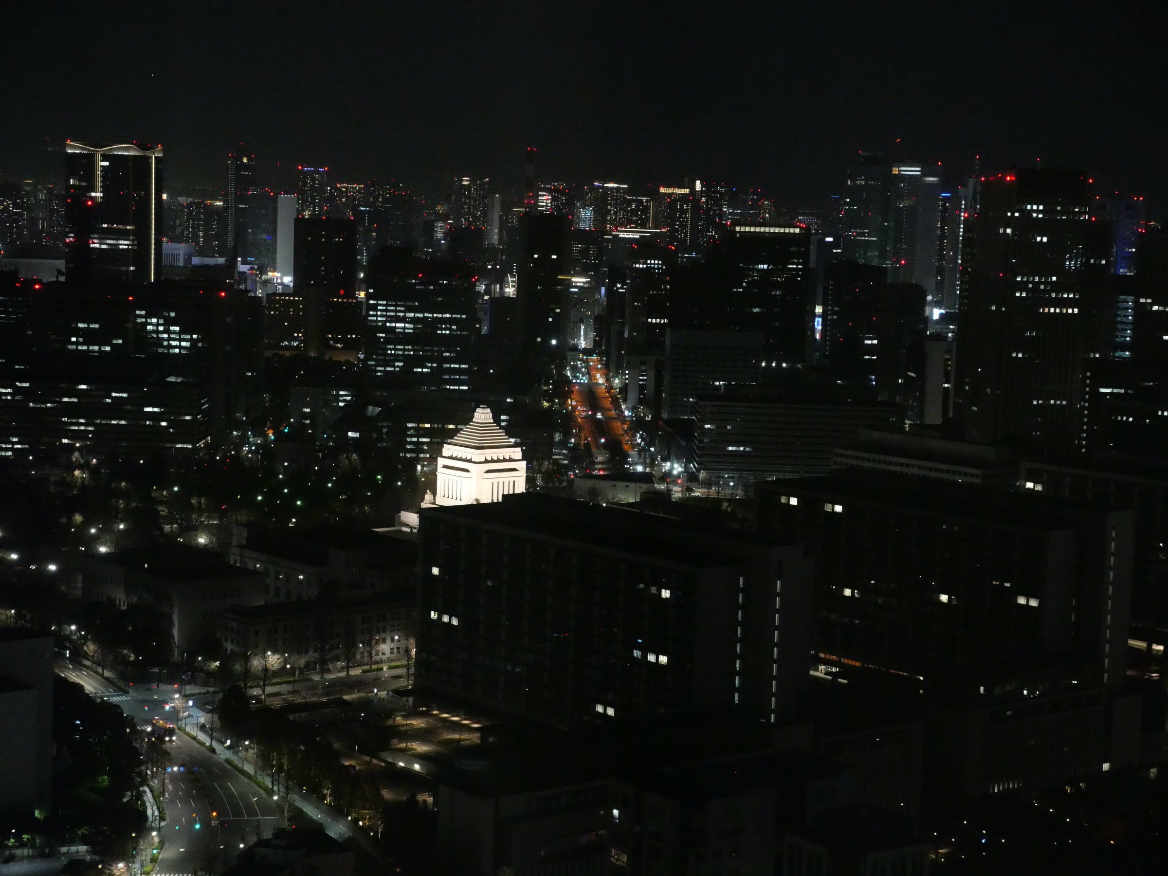 A lit landmark among the city lights.