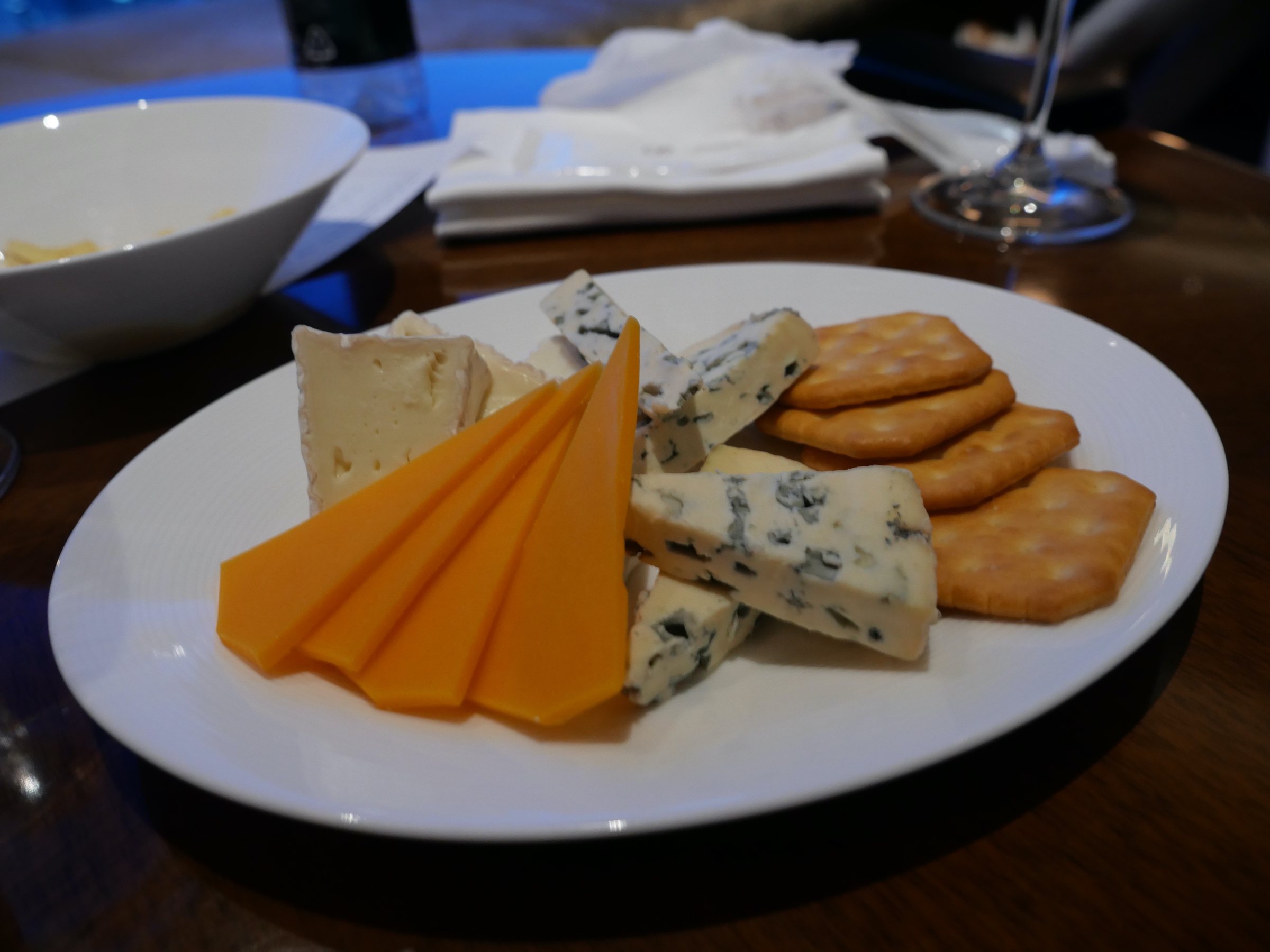 A cheese plate with biscuits, brought from the kitchen on request.