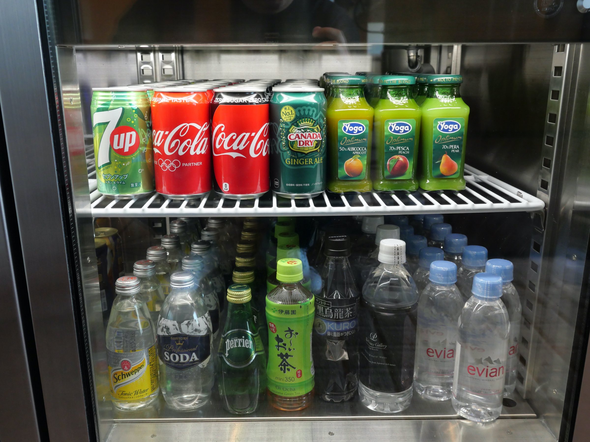 A chilled cabinet of soft drinks and water.