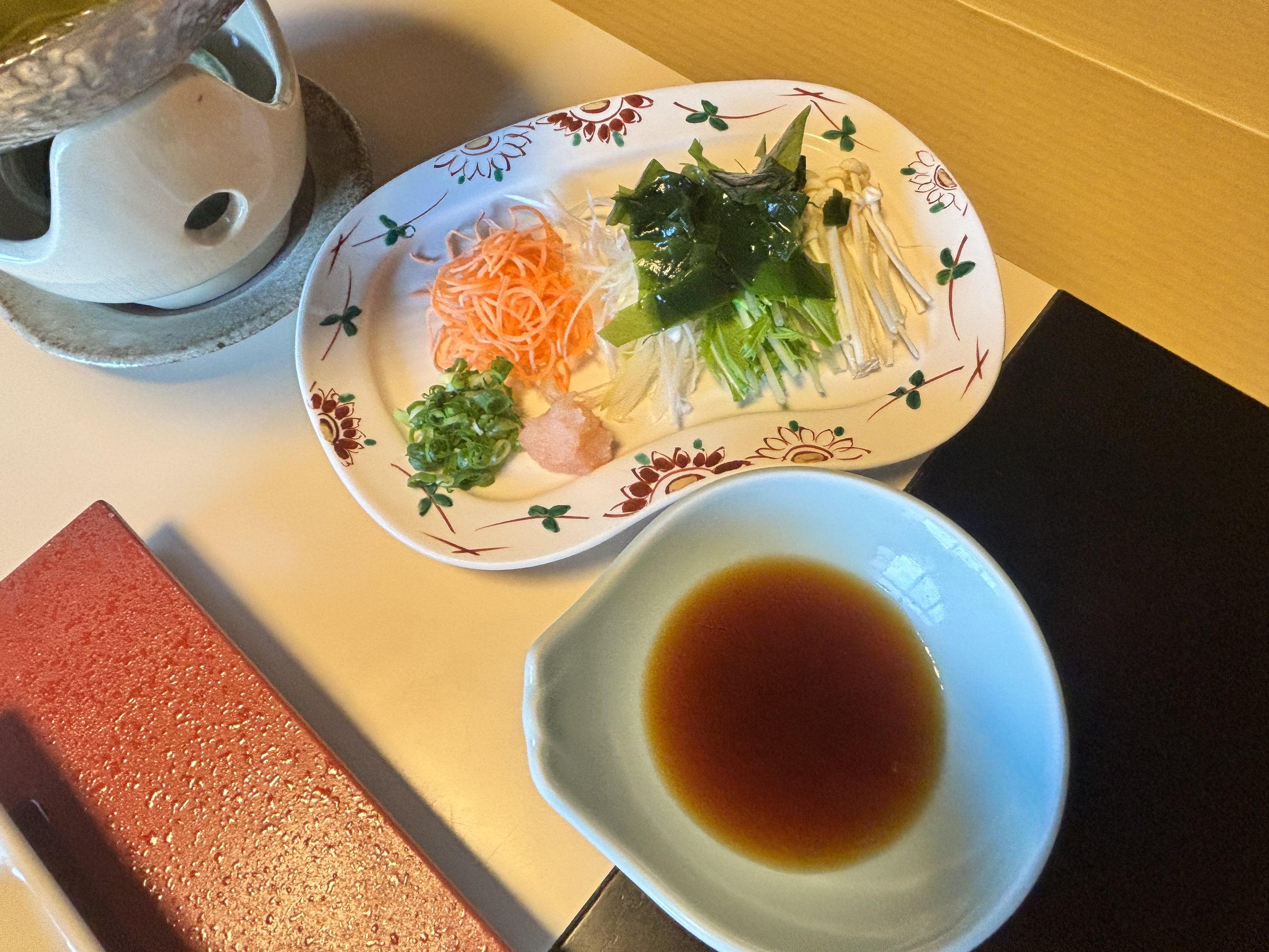 Vegetables and condiments, with a dish of ponzu.
