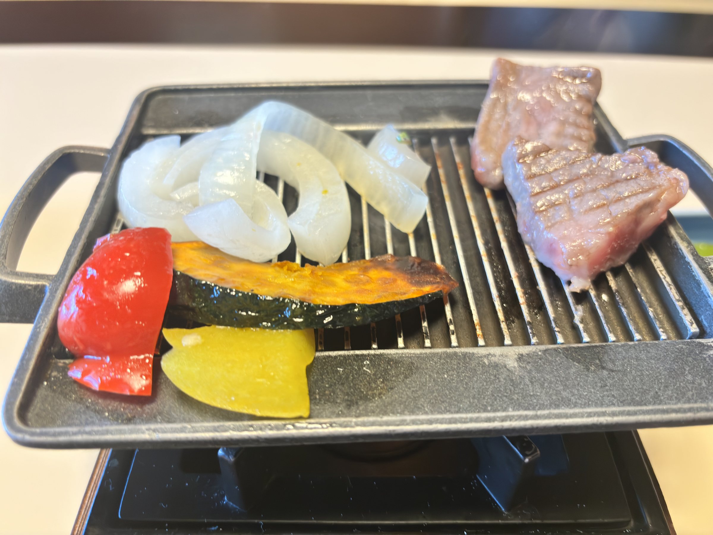 Beef and vegetables on the tabletop griddle.