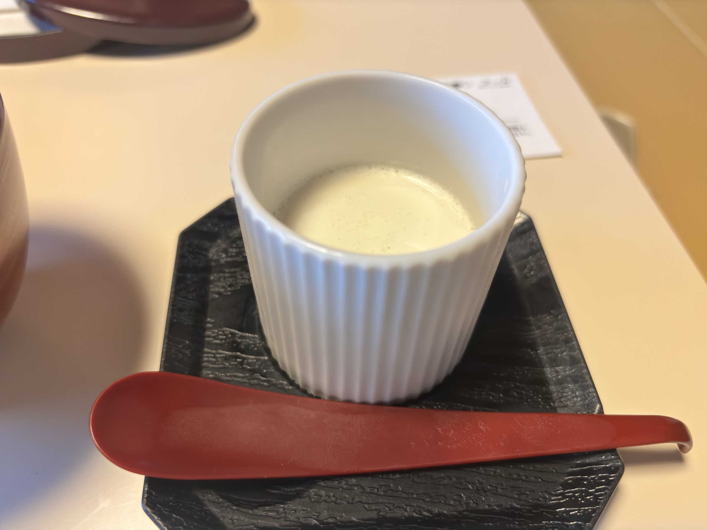 Pudding in a white ramekin.
