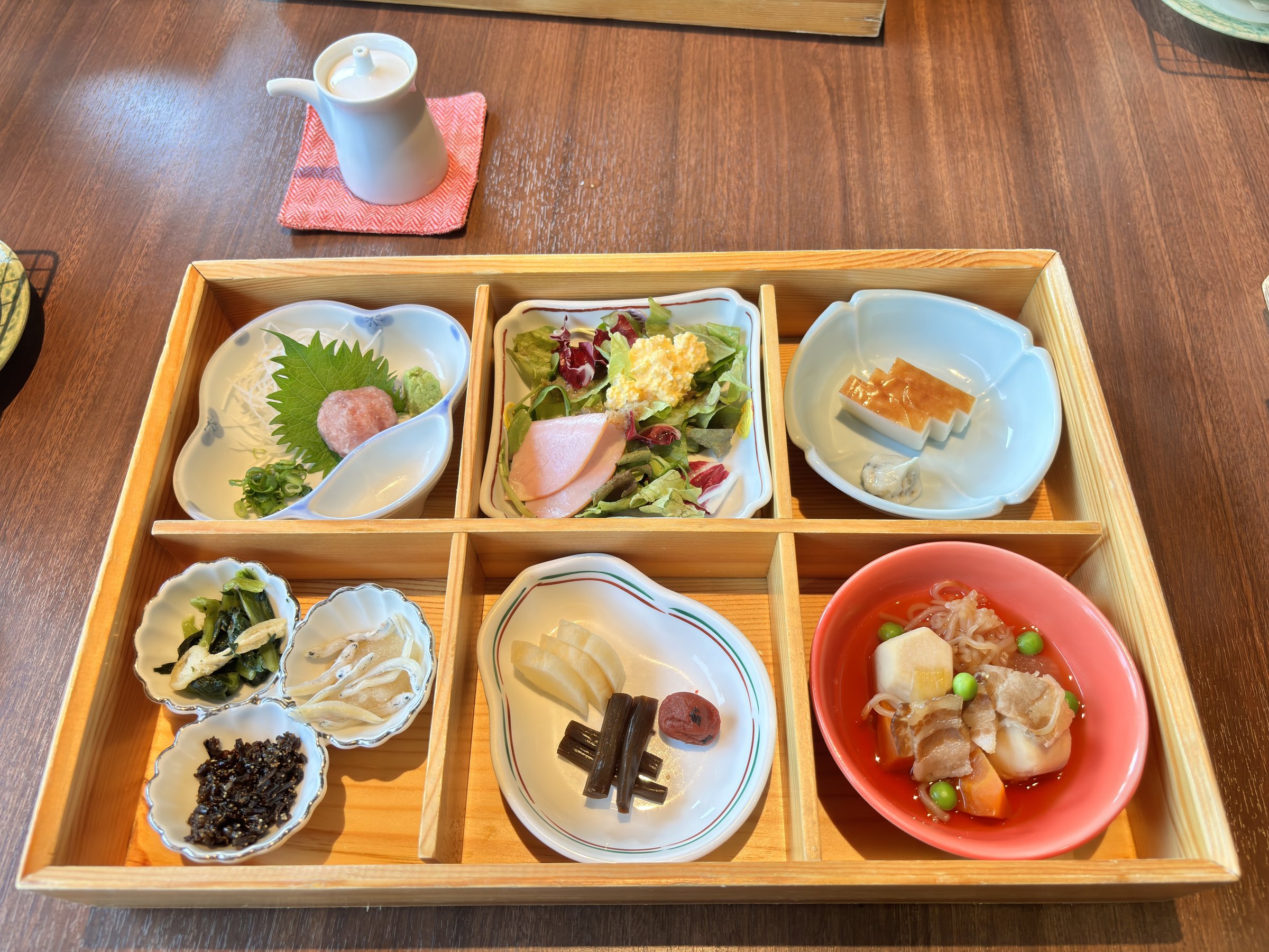 The breakfast box of small dishes.