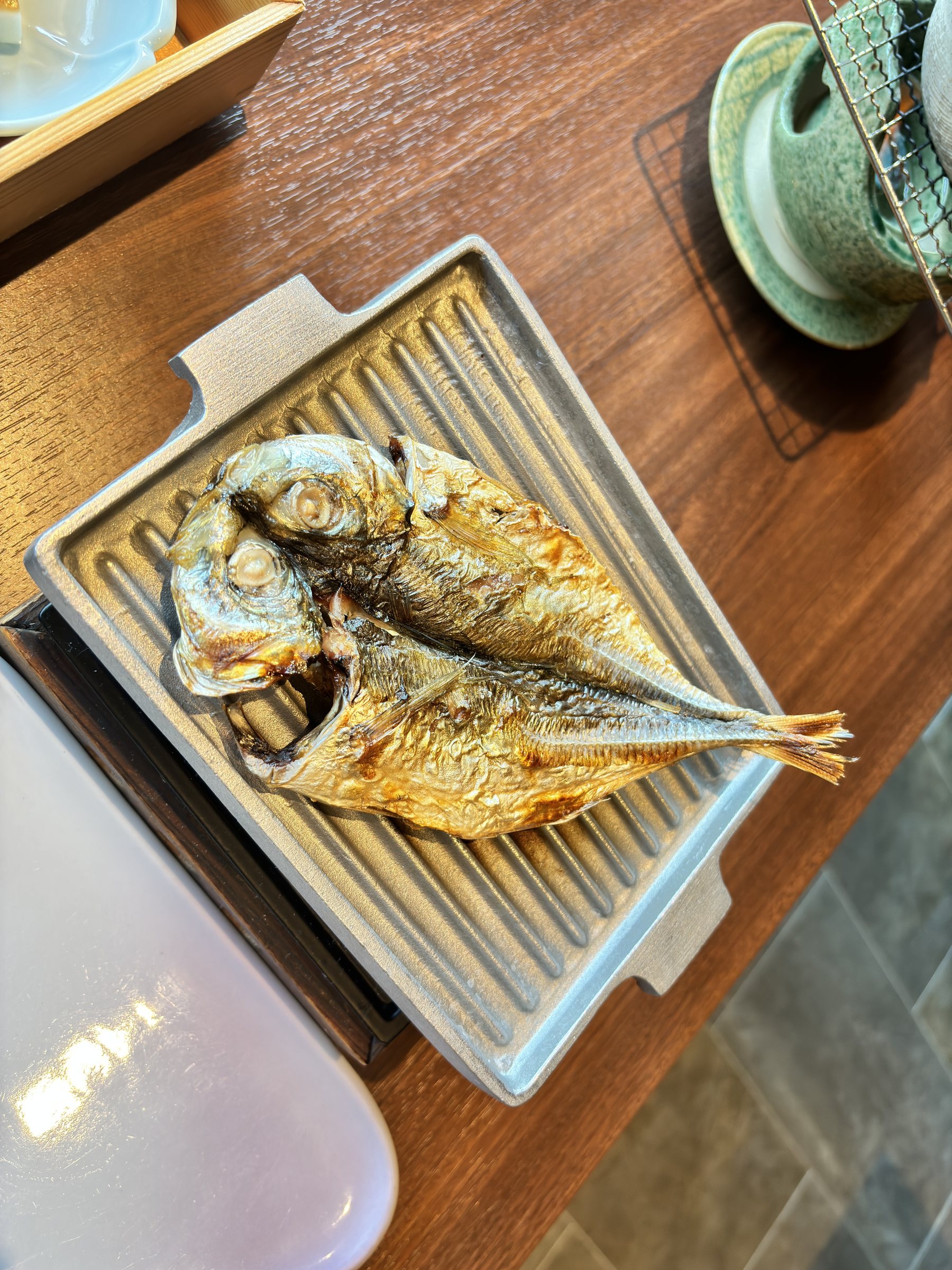 Dried horse mackerel on the griddle.