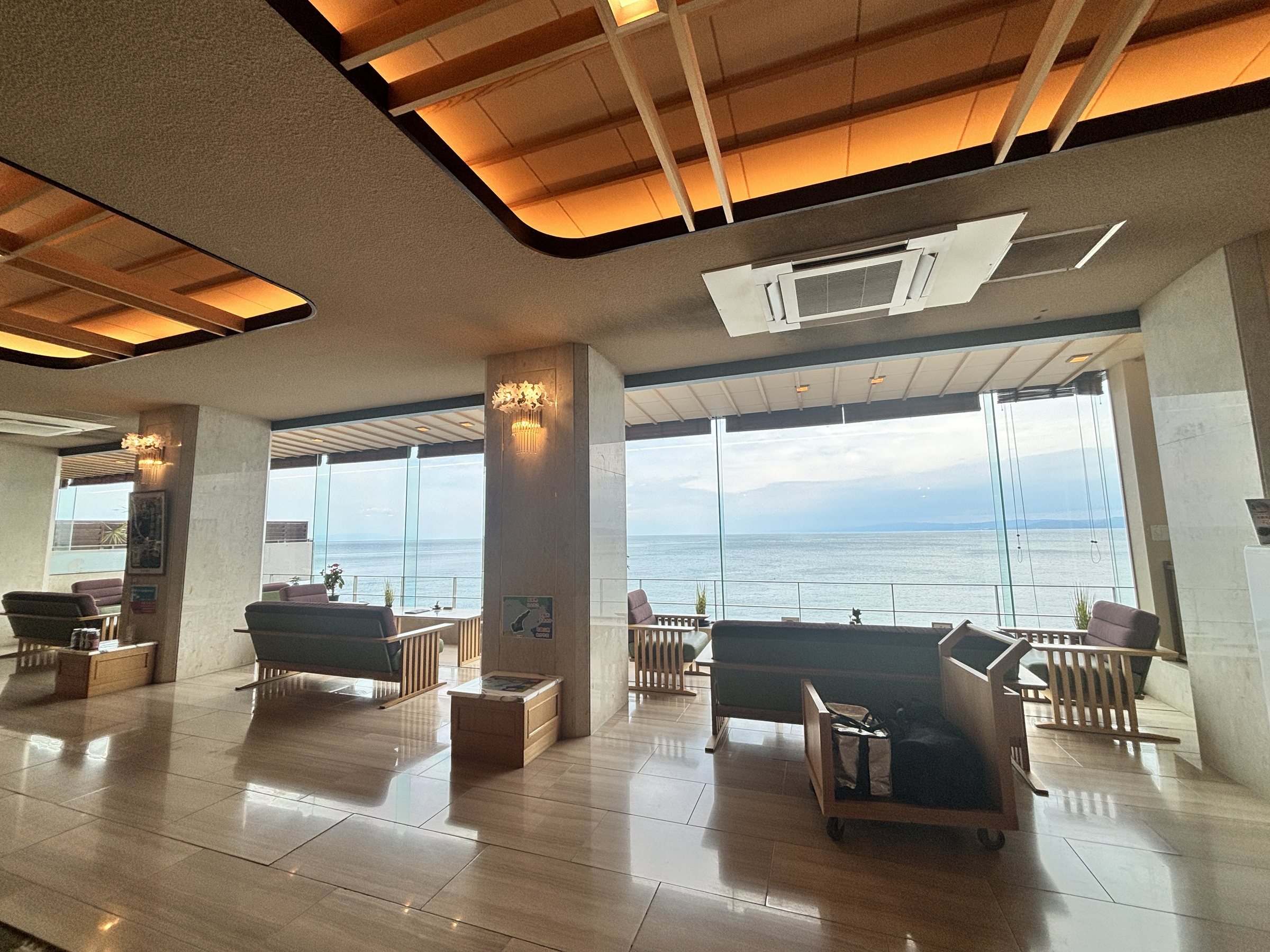 The lobby, with floor-to-ceiling windows onto the sea.