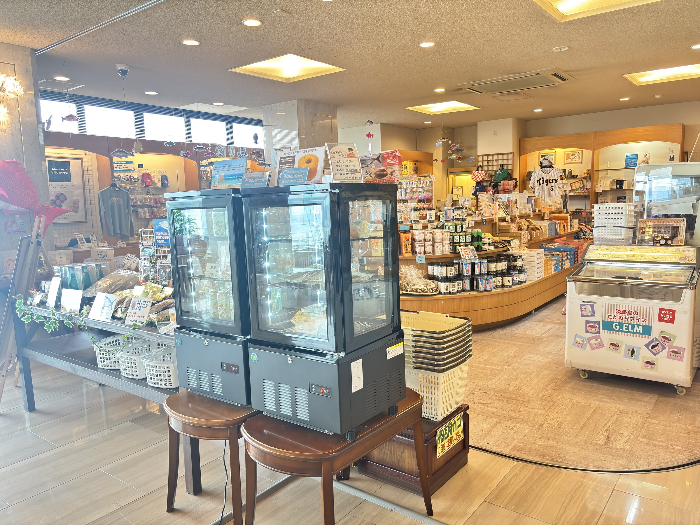 The gift shop, with chiller cabinets and local produce.