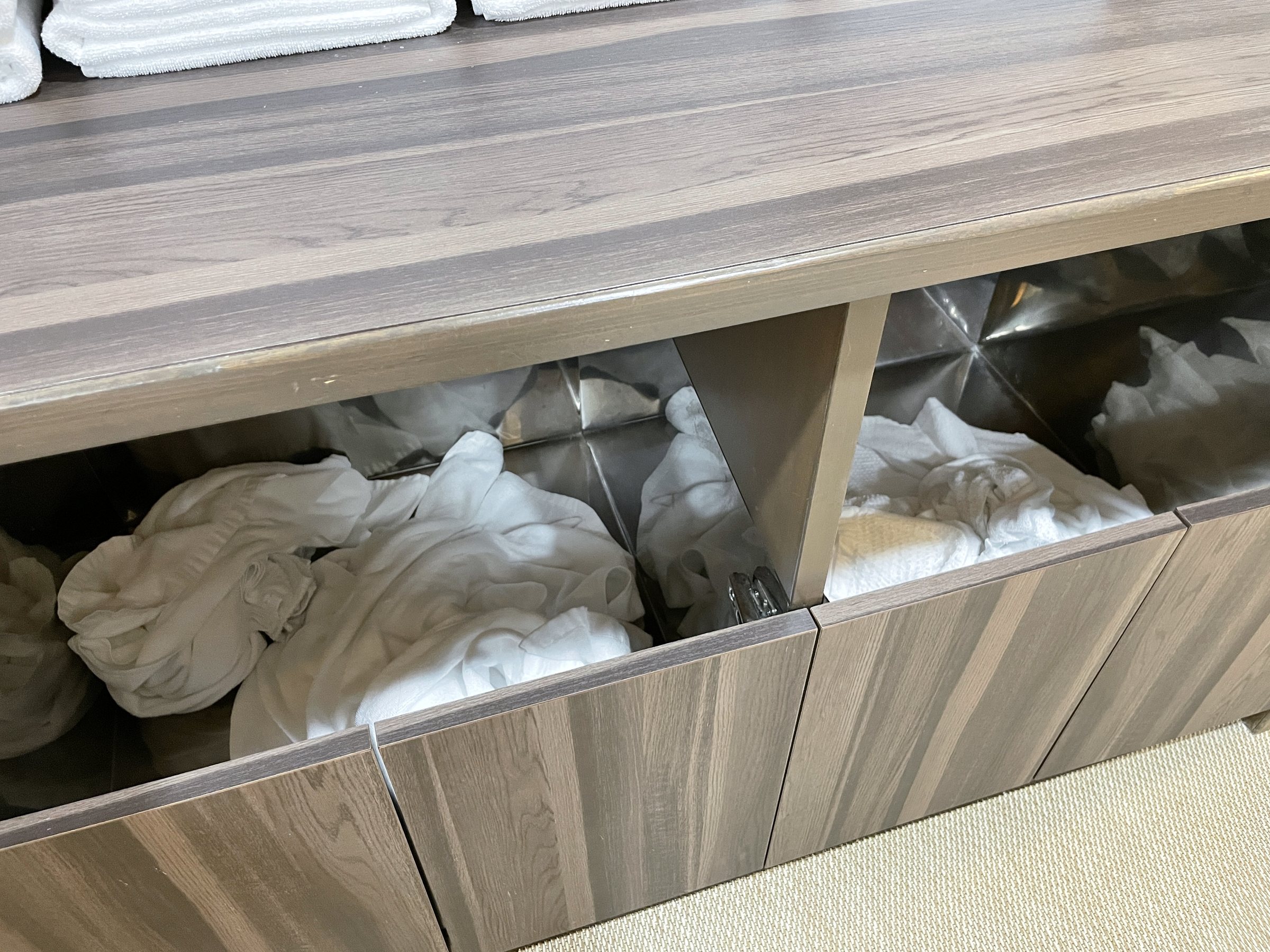 Bins of used towels in the changing room, not yet cleared.