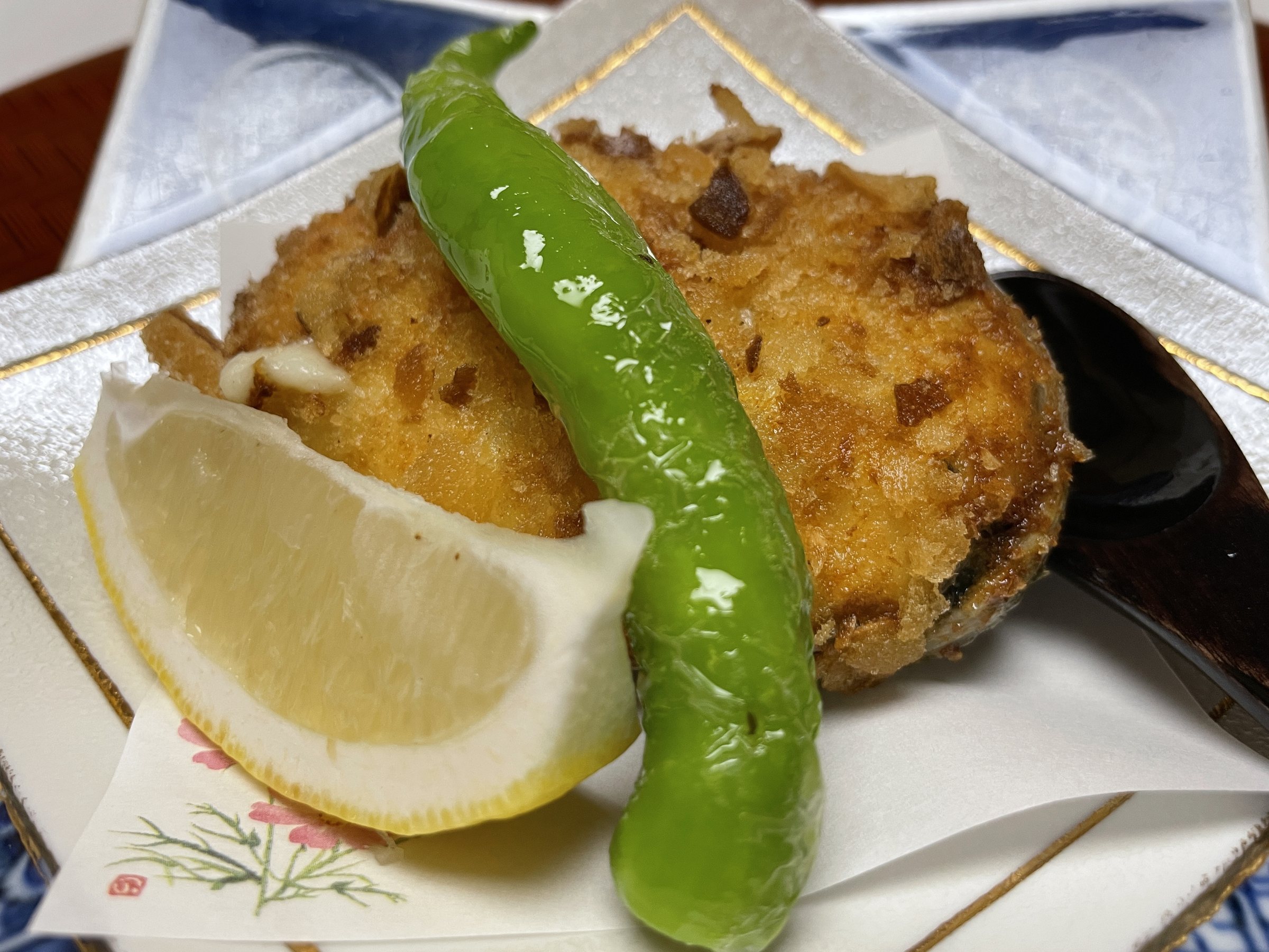 A crisp-crusted seafood gratin with abalone, lemon and a green pepper.
