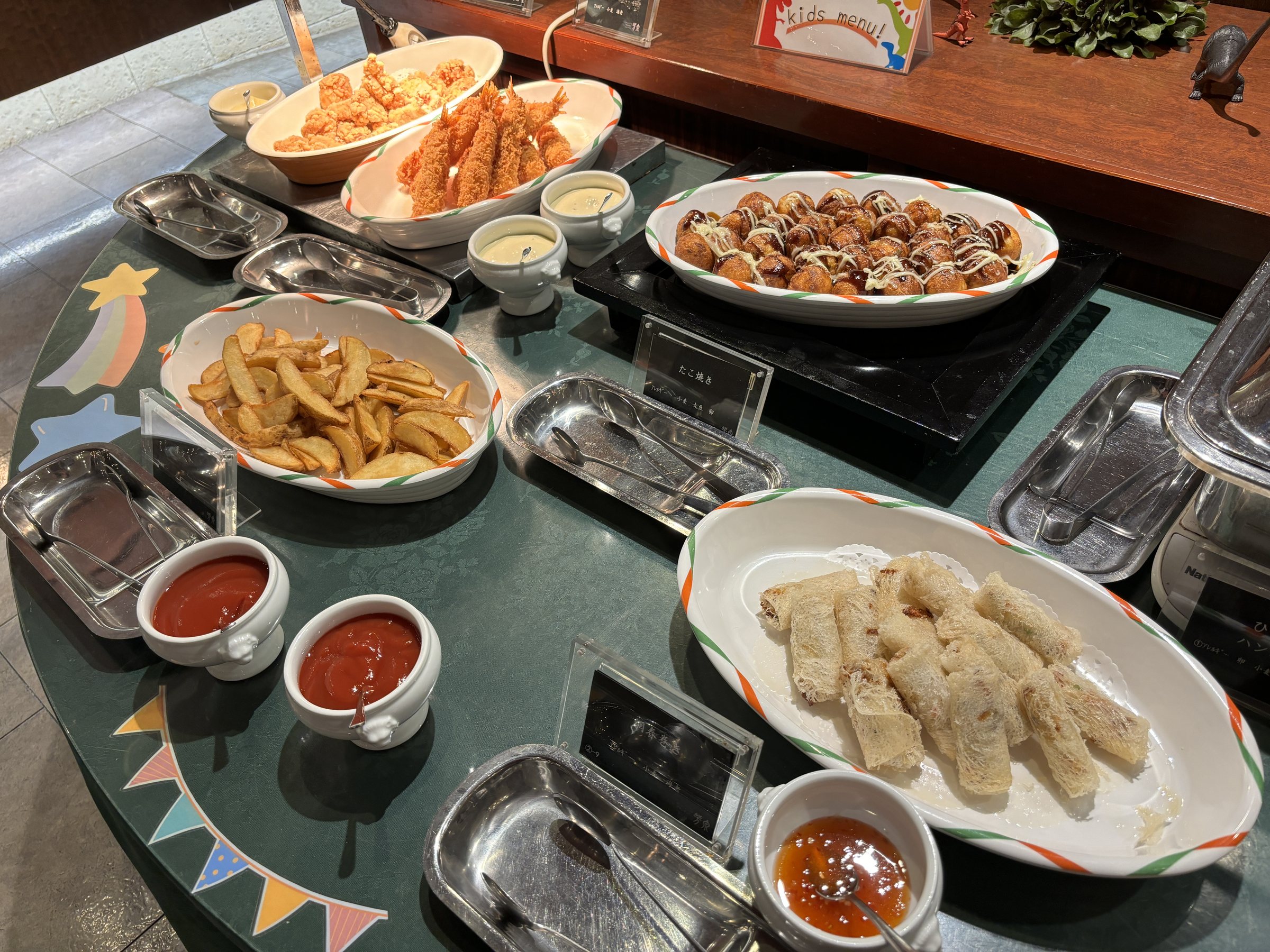 A round counter of fried dishes, dips and sauces.