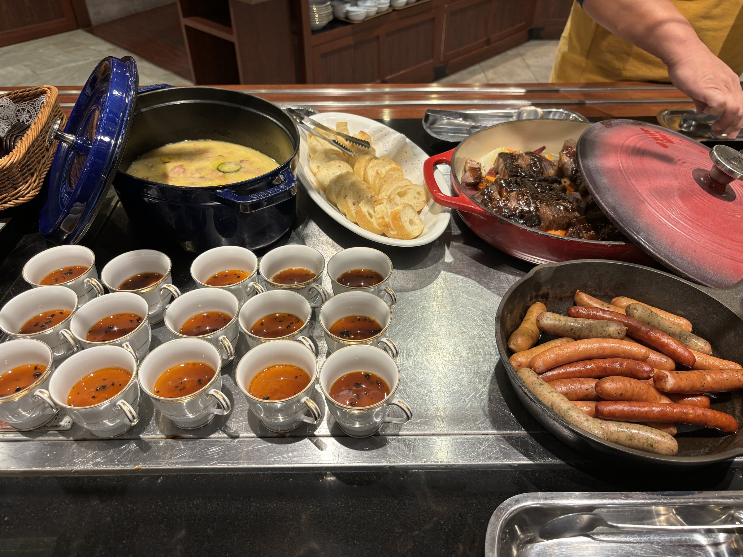Sausages, cups of soup and a casserole.
