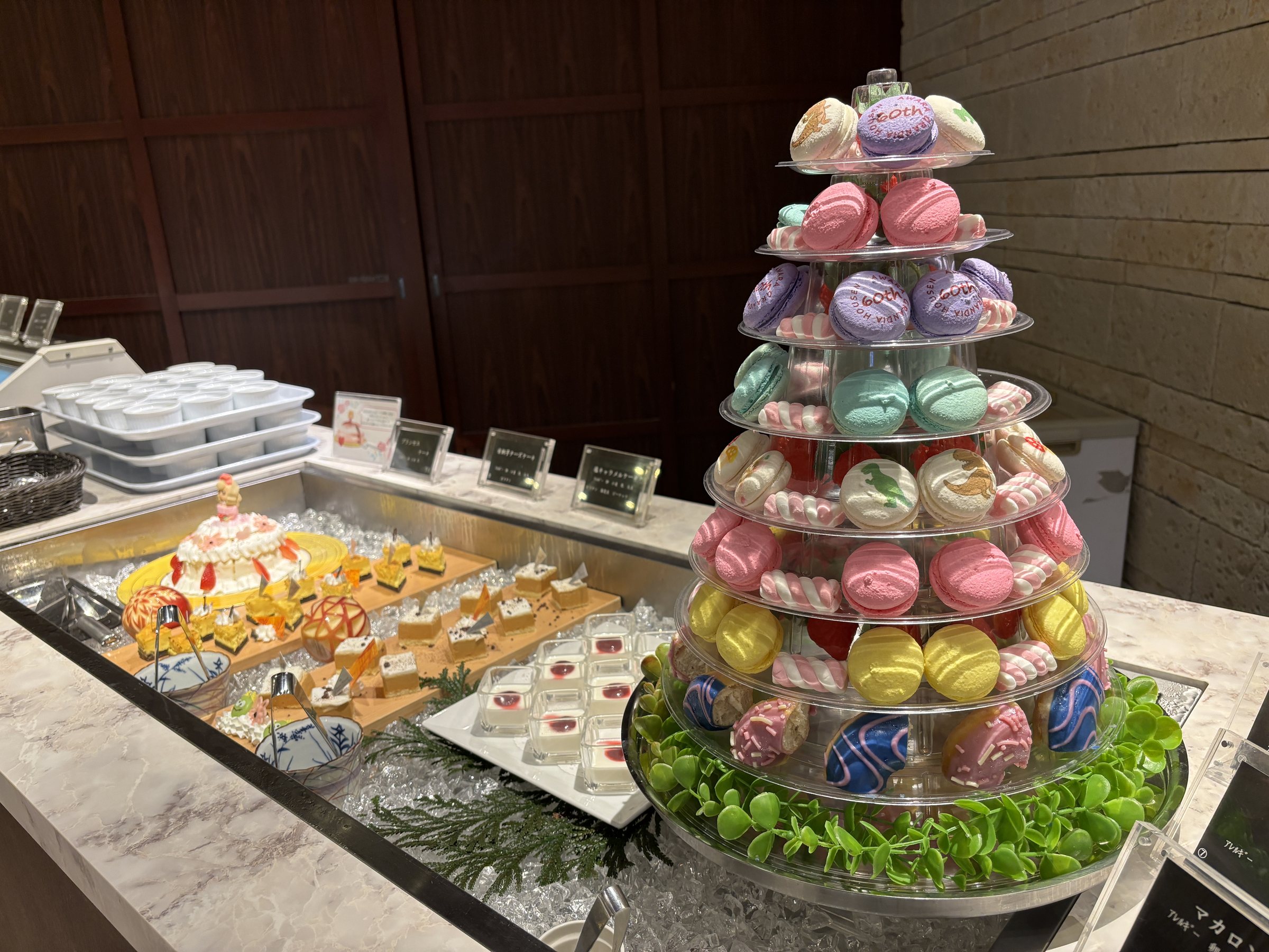 The dessert corner, crowned with a tower of colorful macarons.