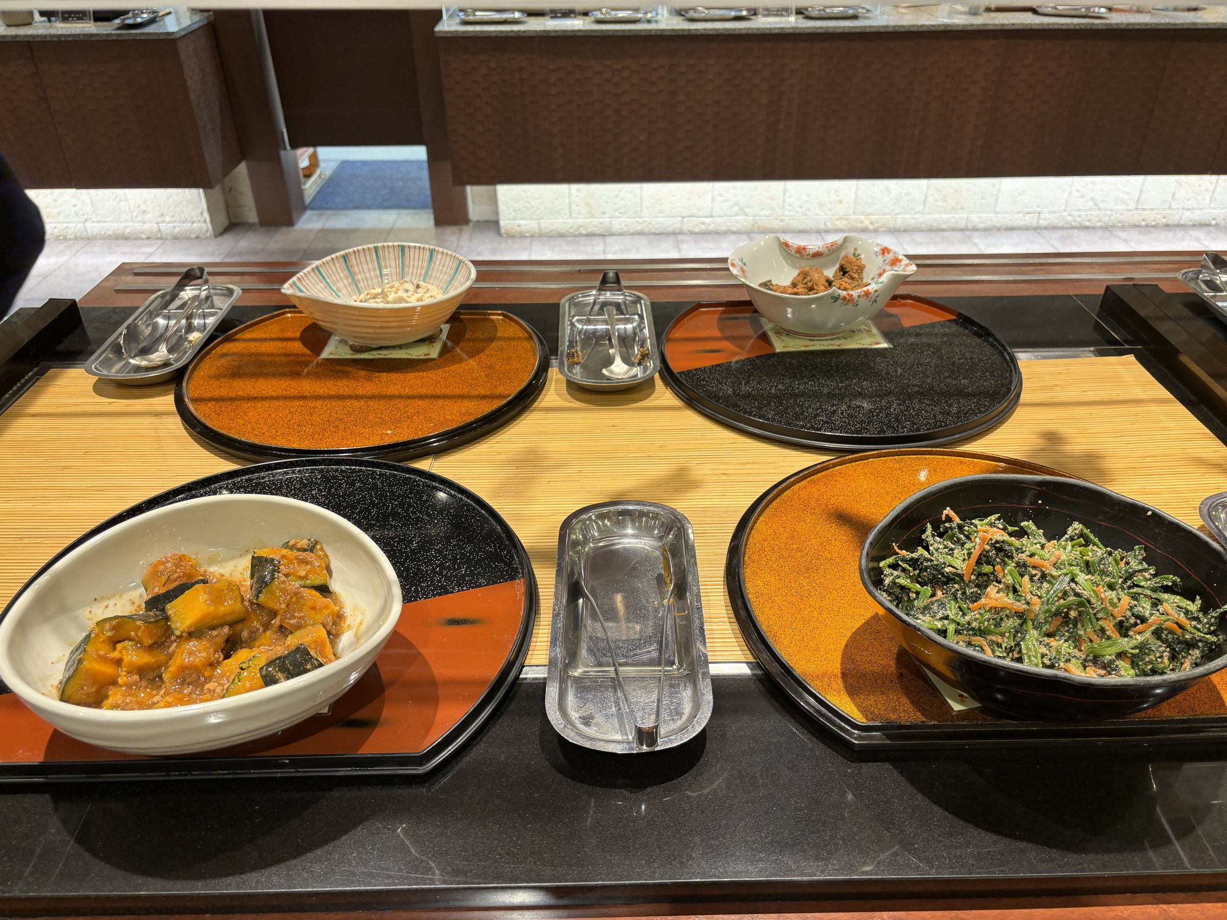 More home-style dishes, including a pumpkin stew and greens.