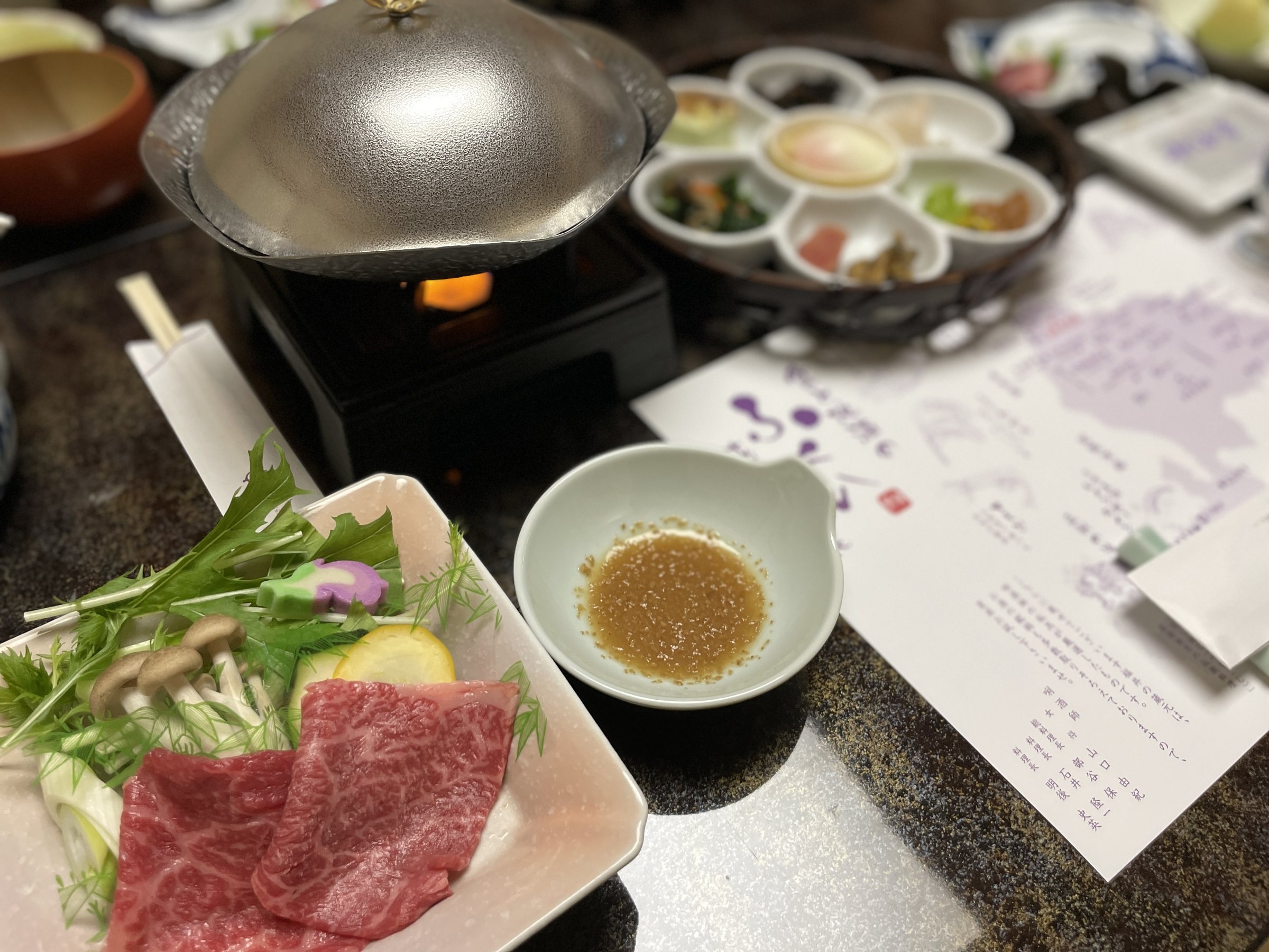 Thinly sliced beef and vegetables ready for shabu-shabu.