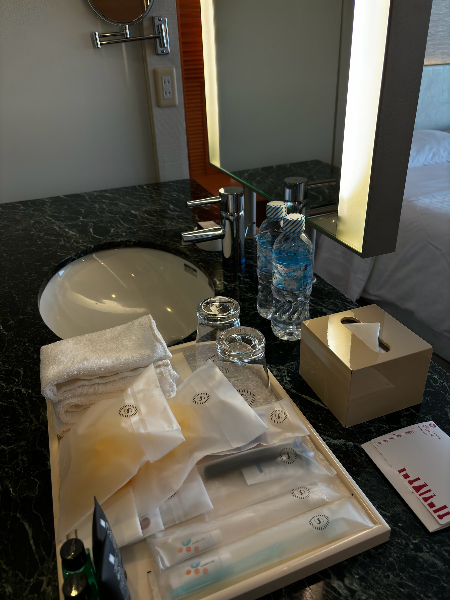 The marble washbasin, with amenities and mineral water.