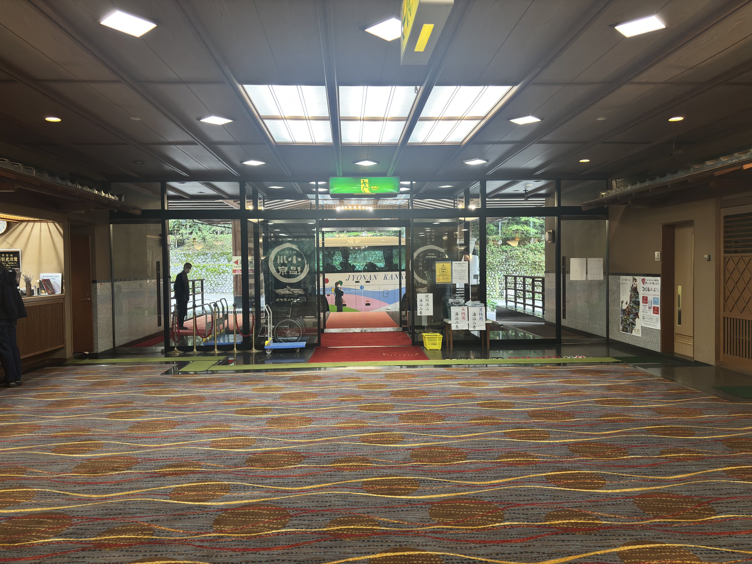 The carpeted approach to the entrance doors.