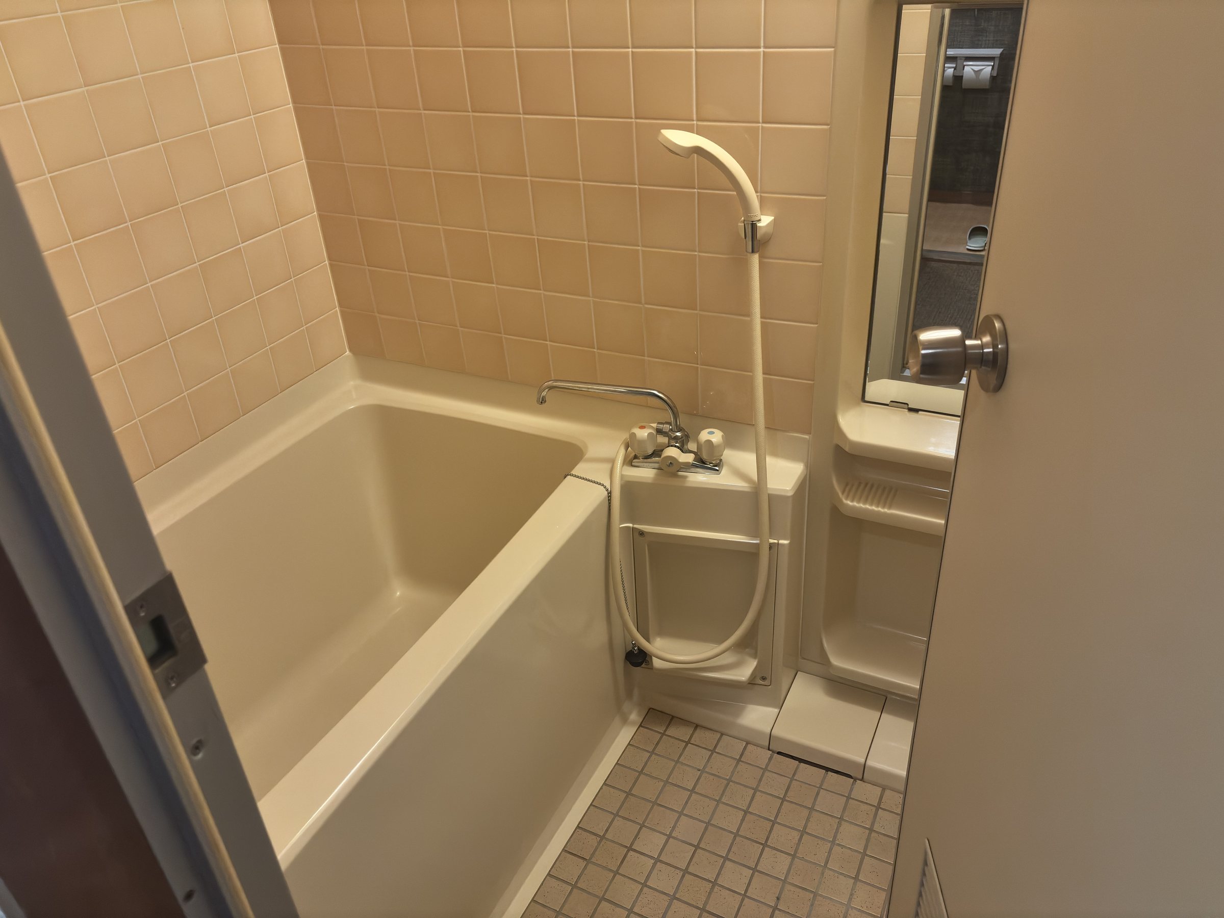 The small tiled bathroom.
