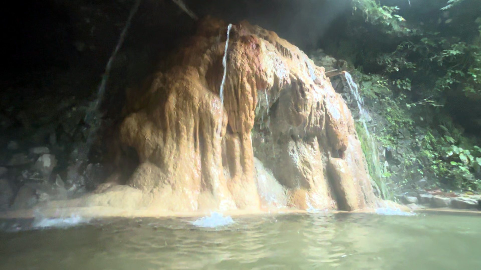Mineral formations above the steaming pool.