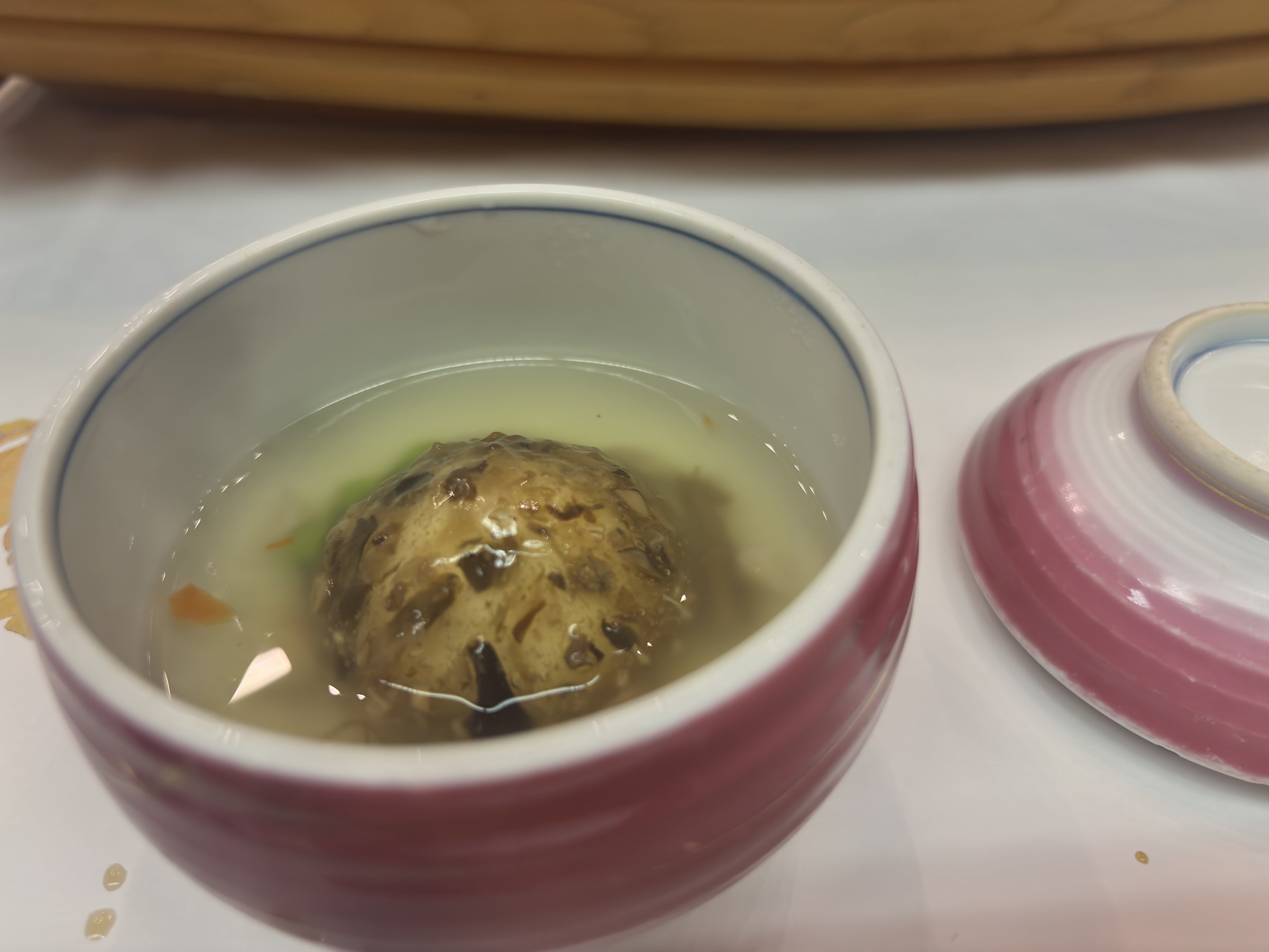 The mushroom dumpling in broth.