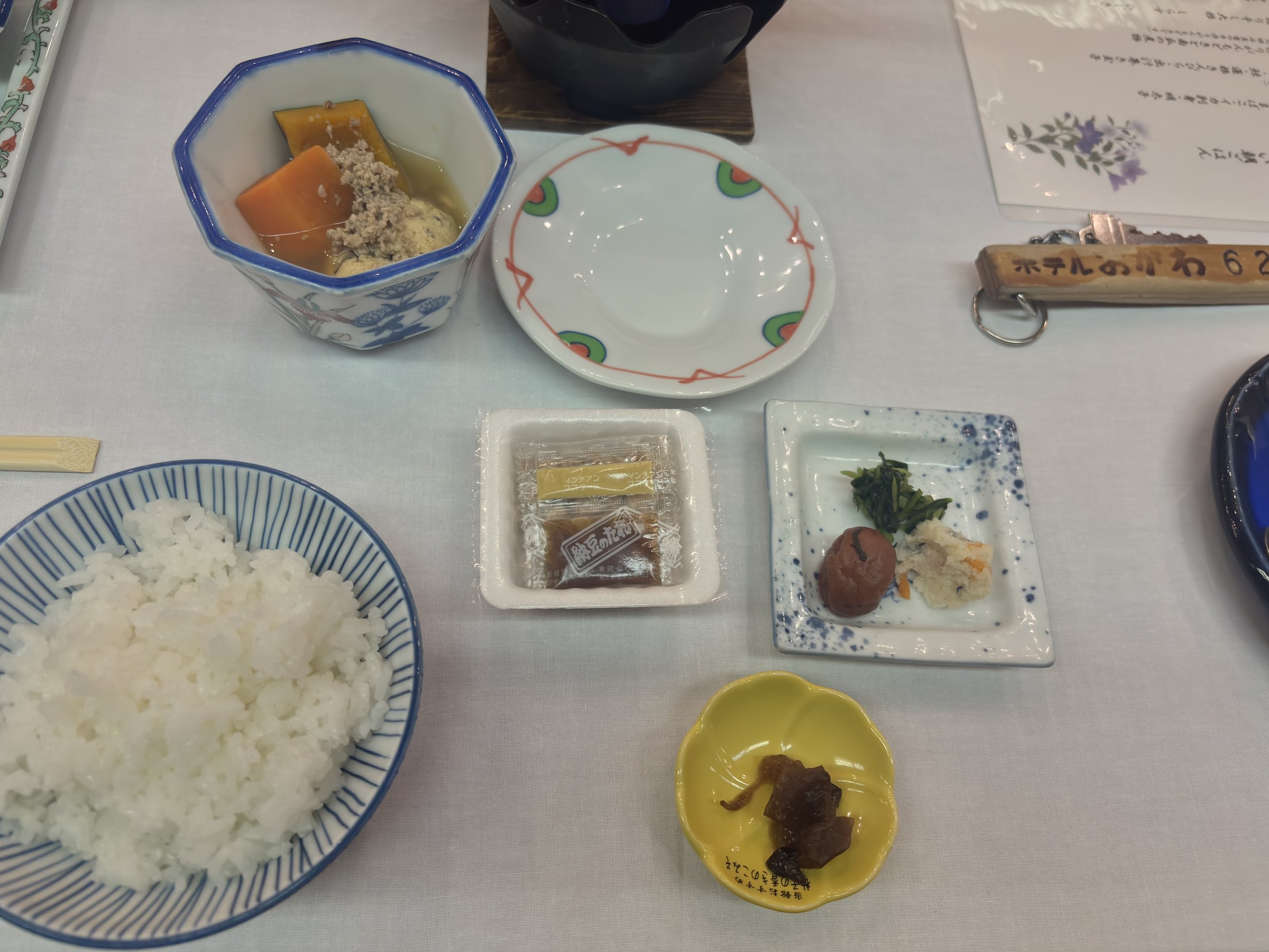 The breakfast table, with rice and side dishes.