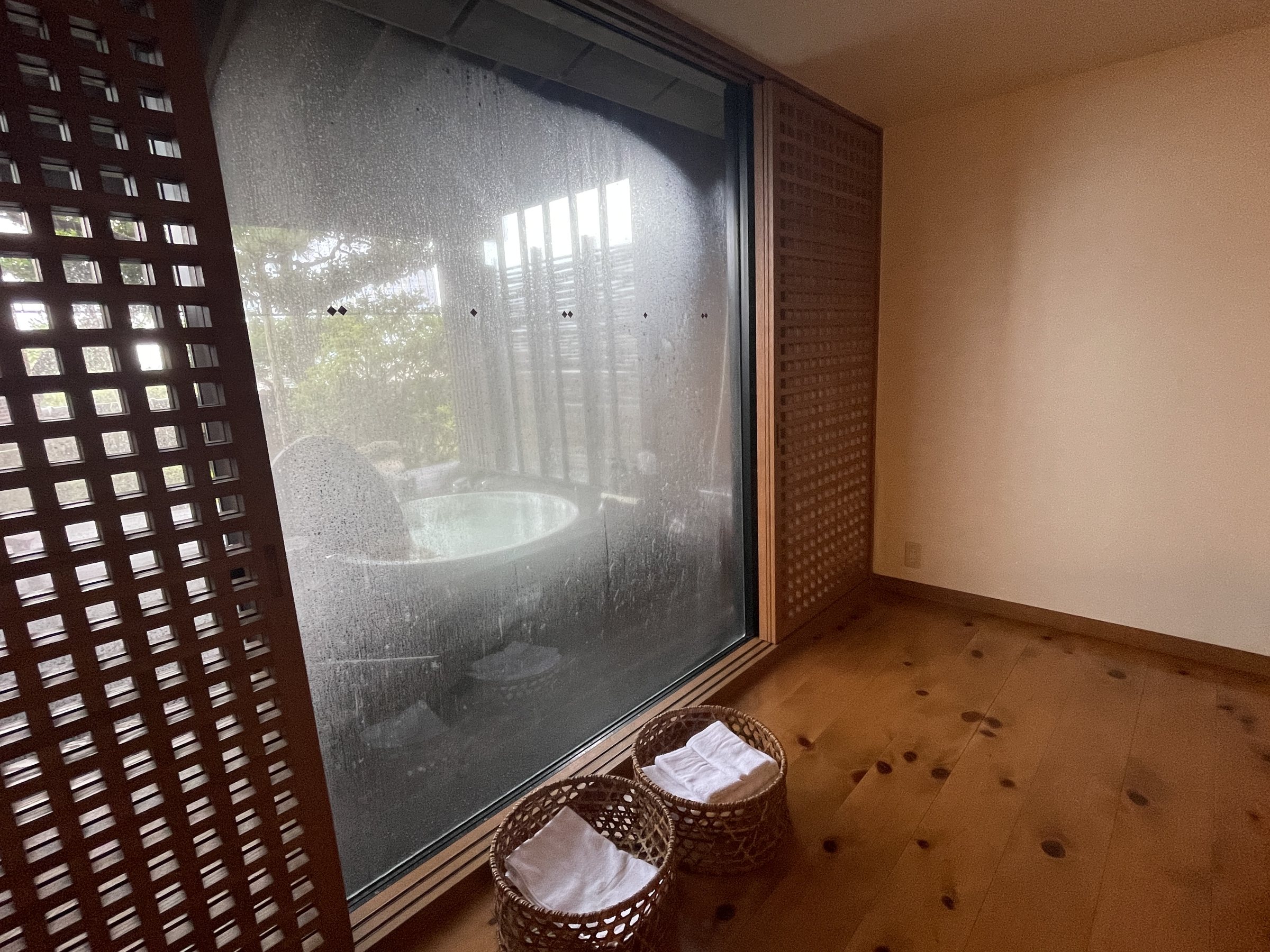 The large window onto the bath, misted over with condensation.