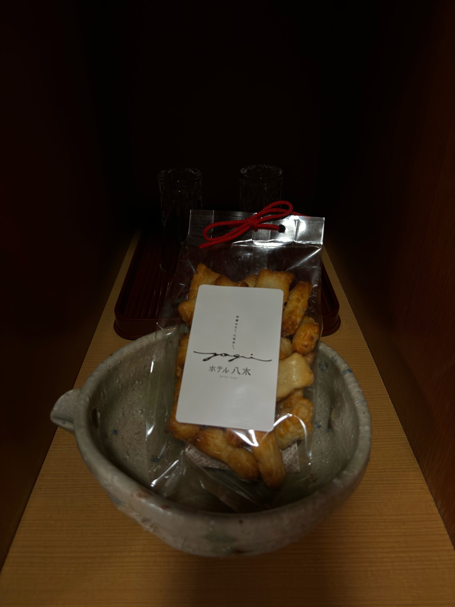 Rice crackers in a ceramic bowl, waiting in the room.