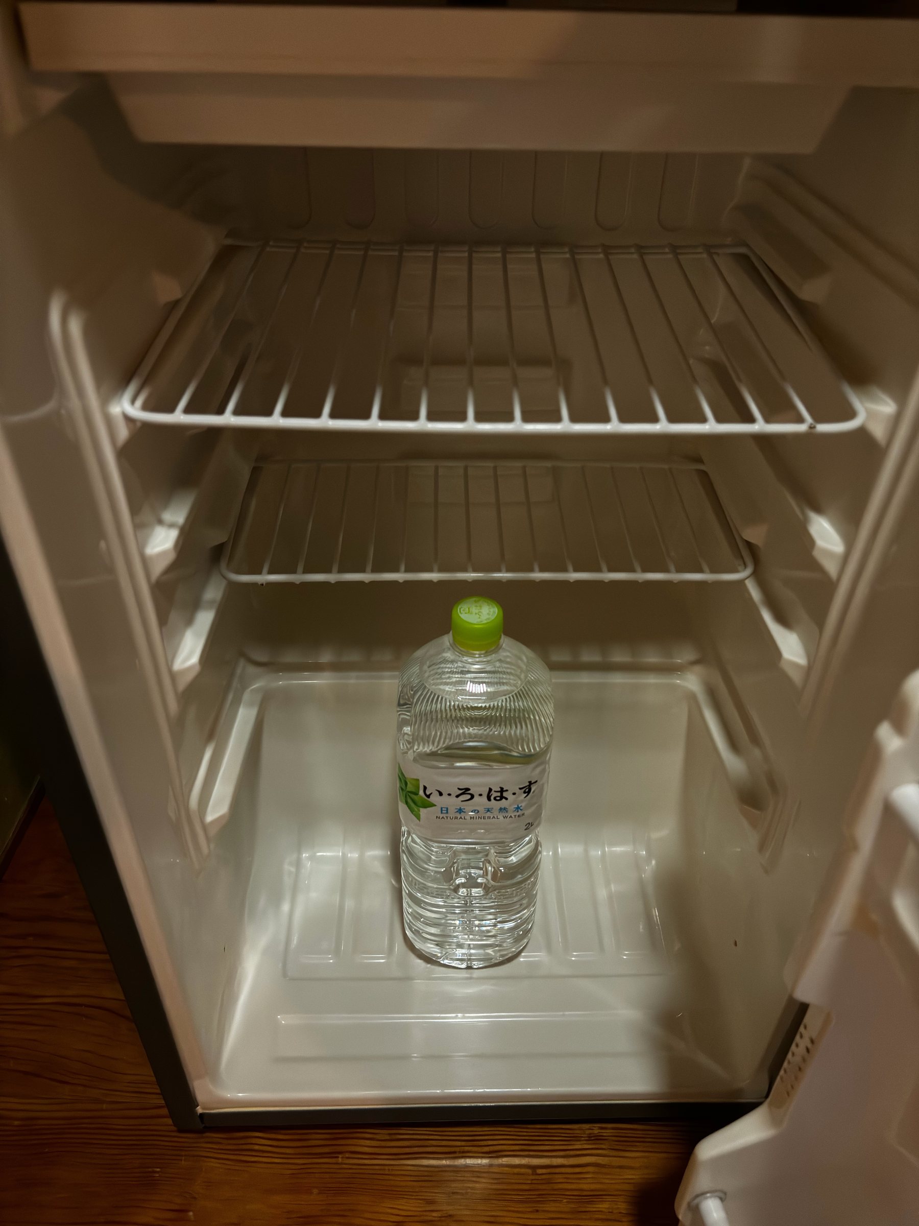 A bottle of water in the room’s fridge.