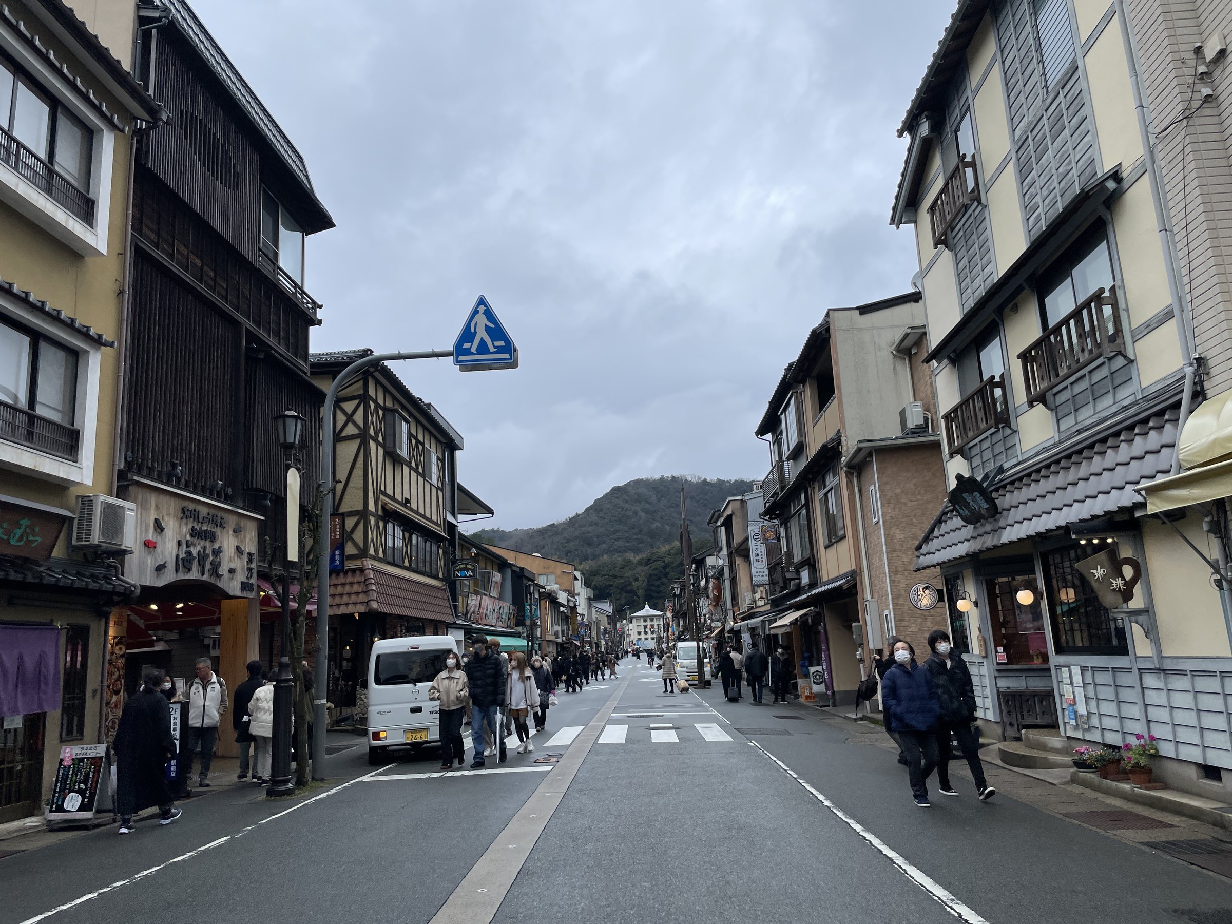 The main street of the hot spring town, busy despite the weather.