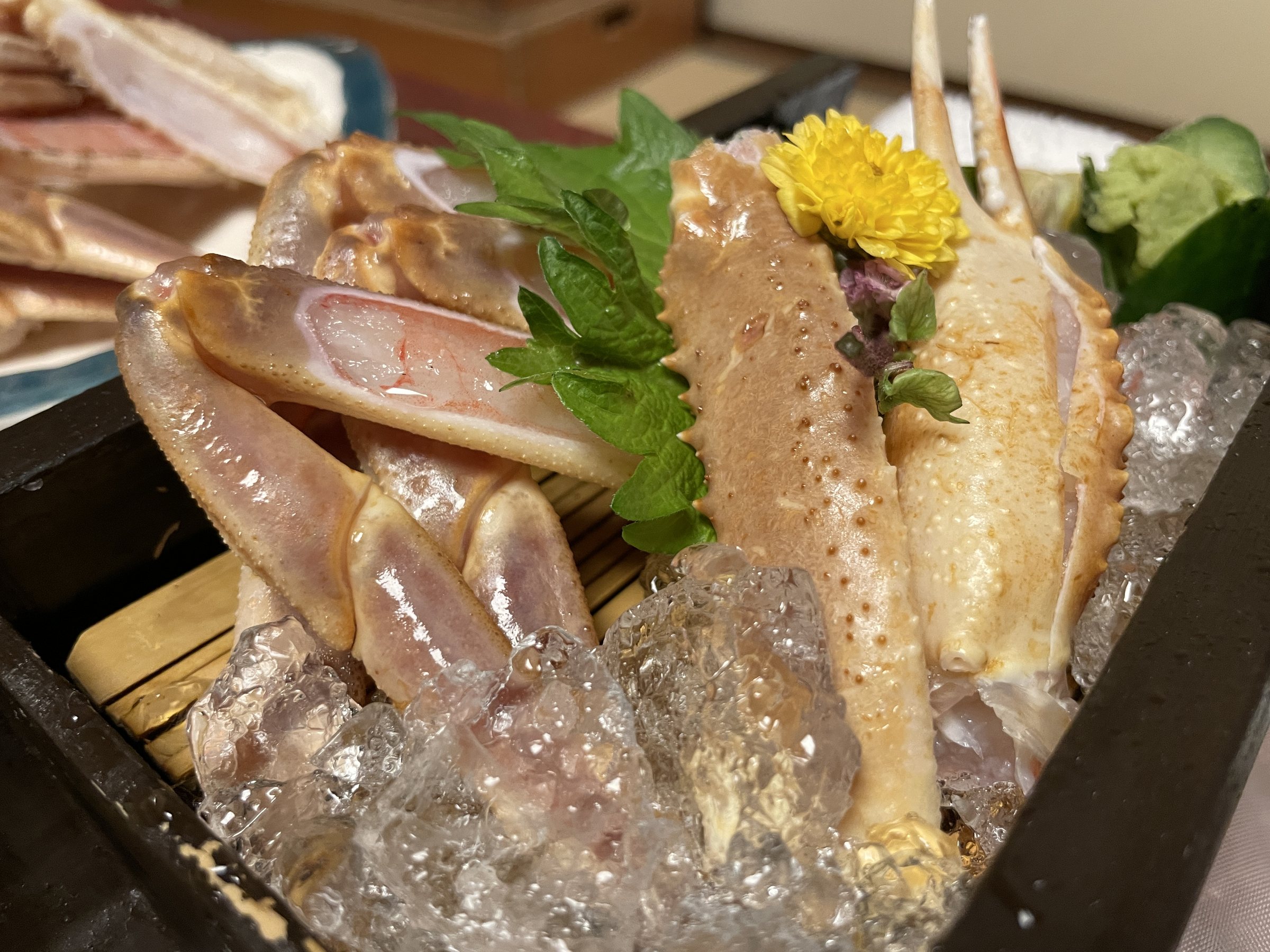 Crab sashimi on crushed ice.