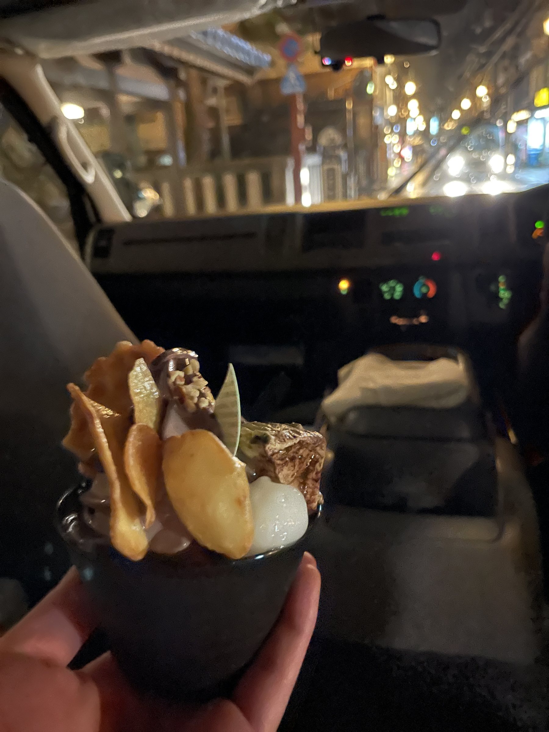 Our takeaway dessert, an ice cream sundae with wafers, in the shuttle bus.