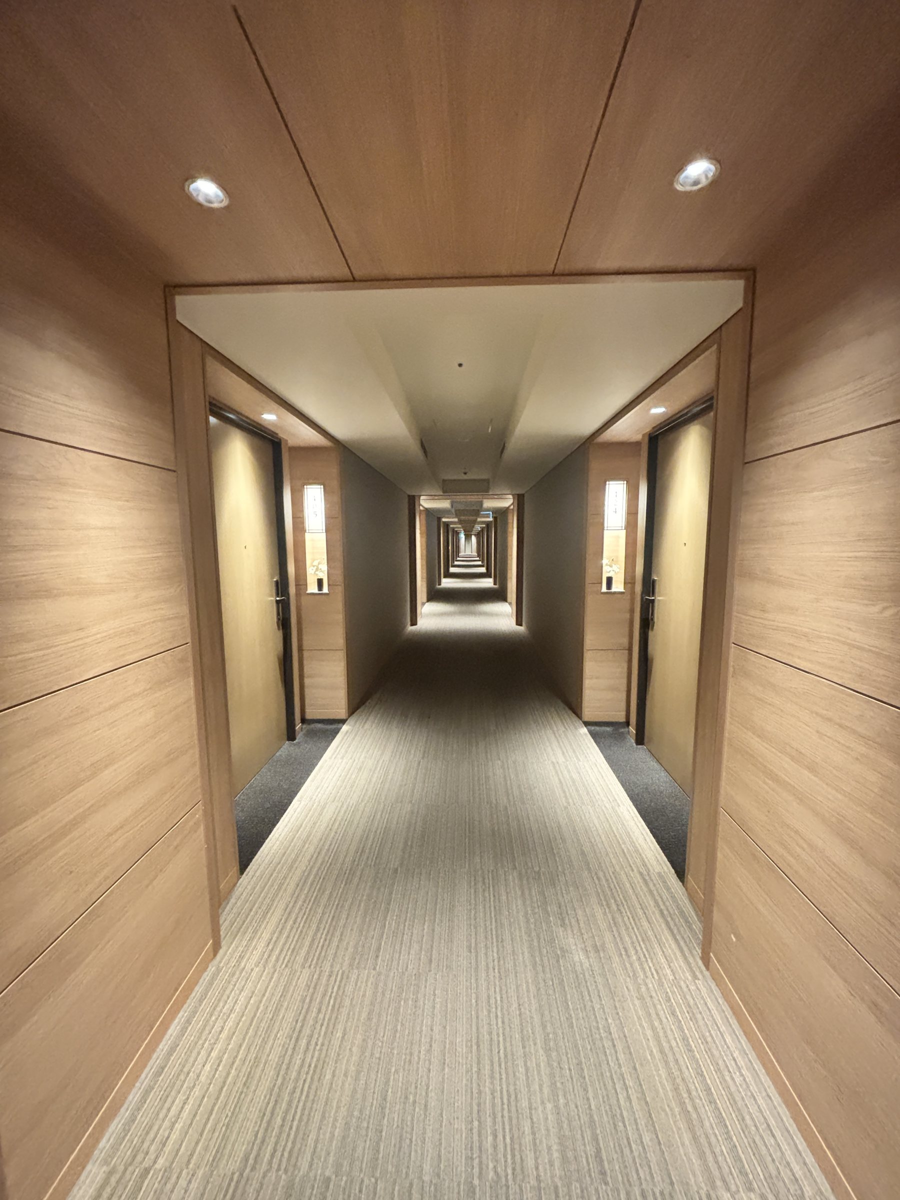 The long, wood-paneled corridor to the suite.