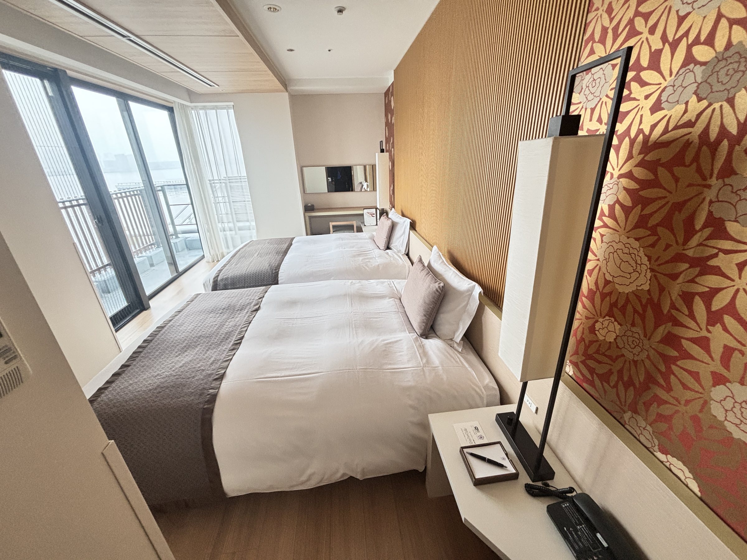 The bedroom, with a patterned feature wall.