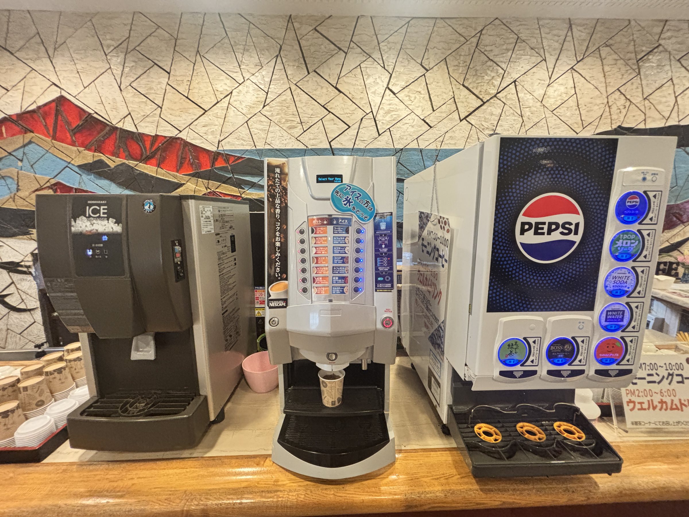 The free-drinks corner: coffee, cocoa and soft-drink machines.