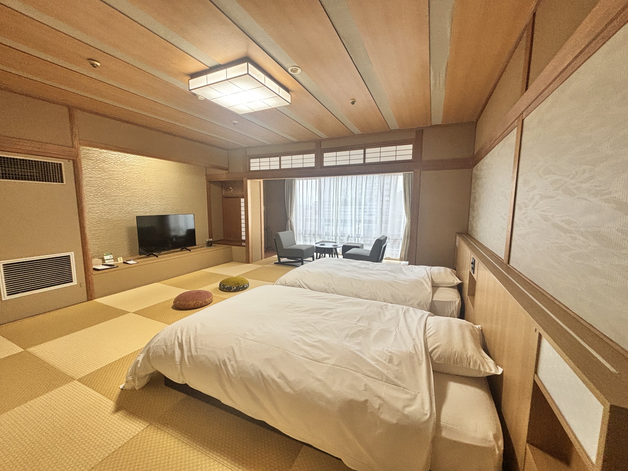 The guest room: twin beds on tatami-style flooring.