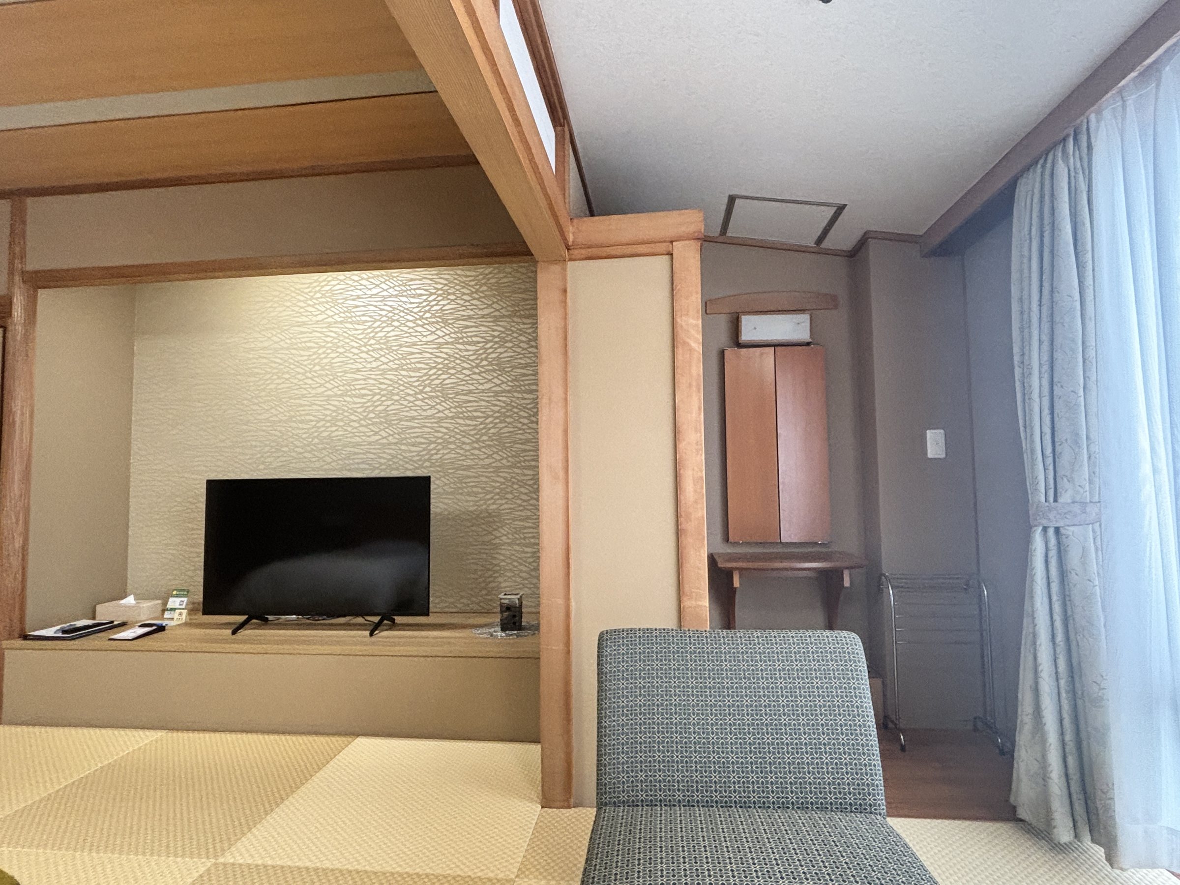 The television alcove and a low chair.