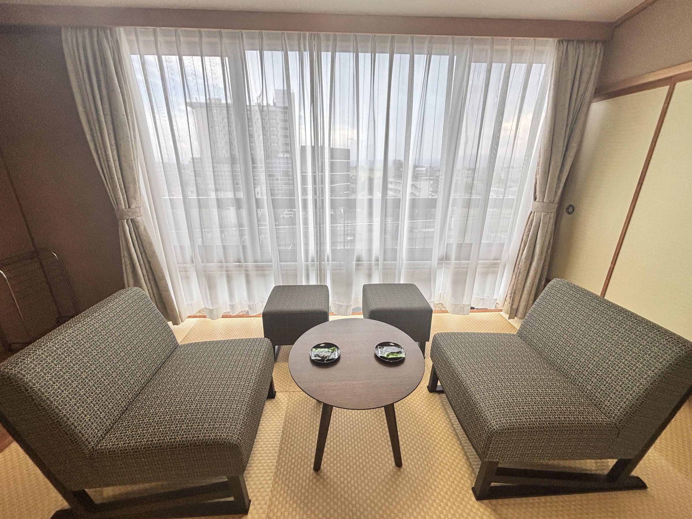 Two armchairs by the window.