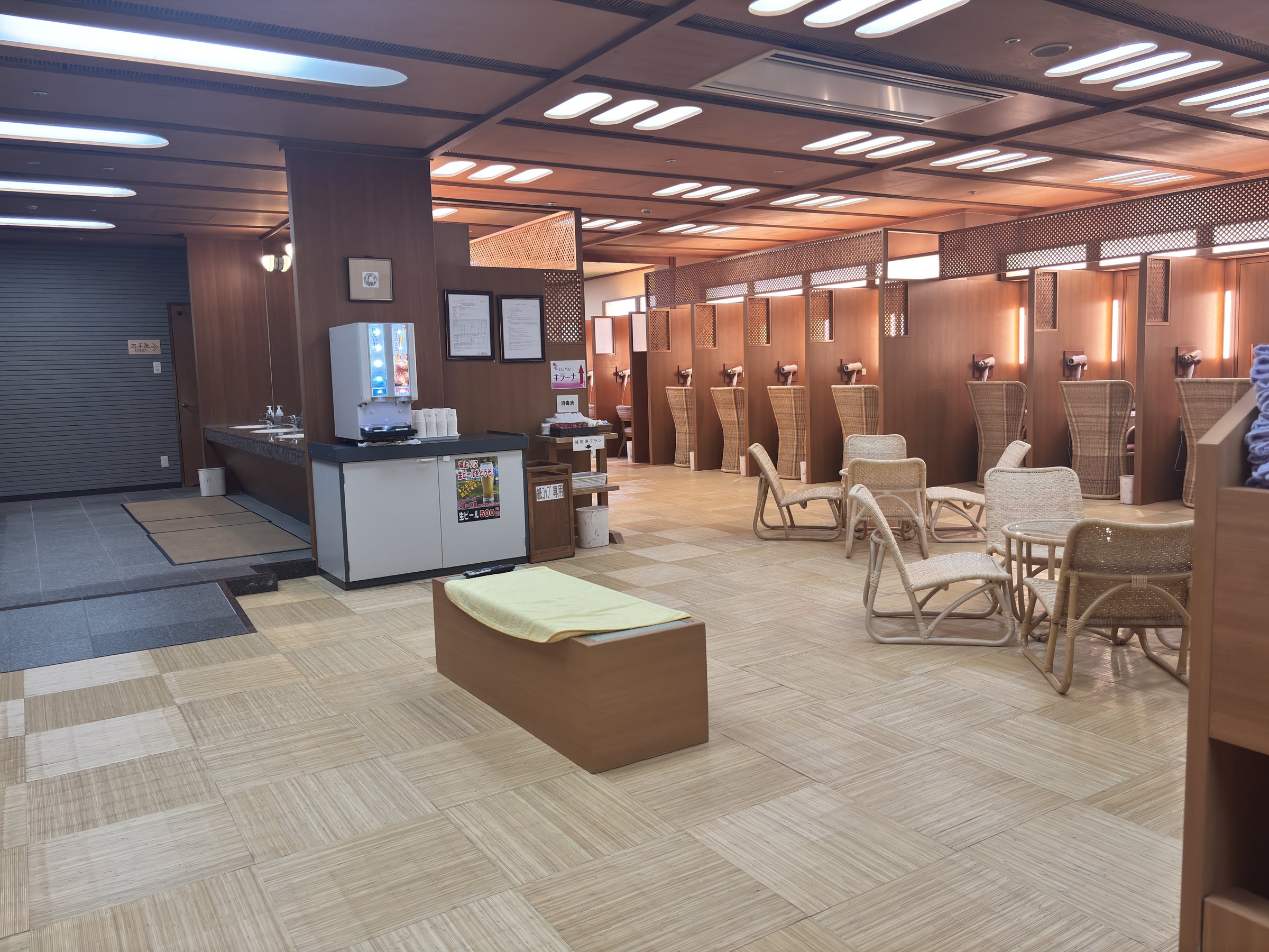 A large open lounge area with rattan chairs.