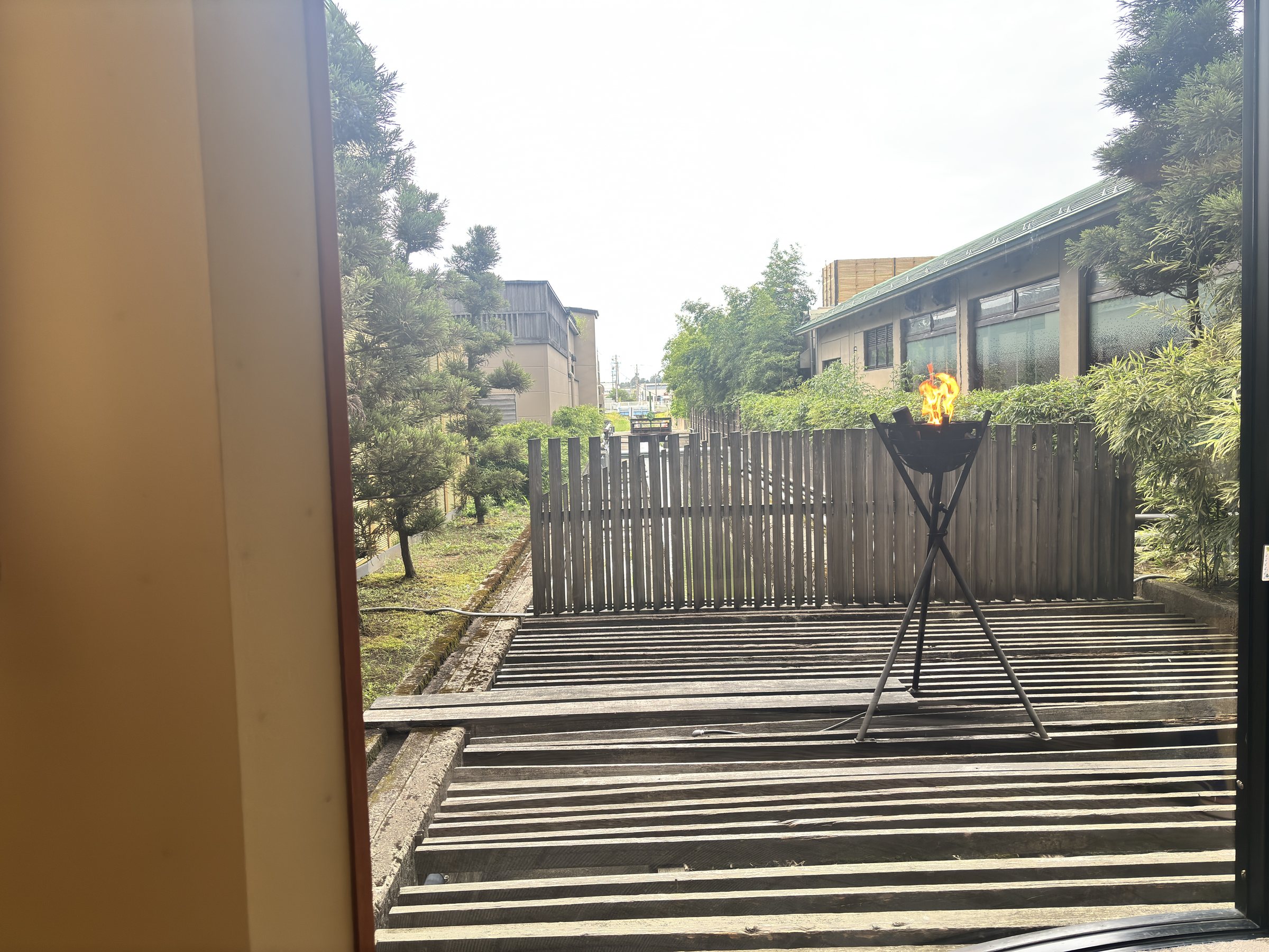 A wooden deck leading out to the garden.