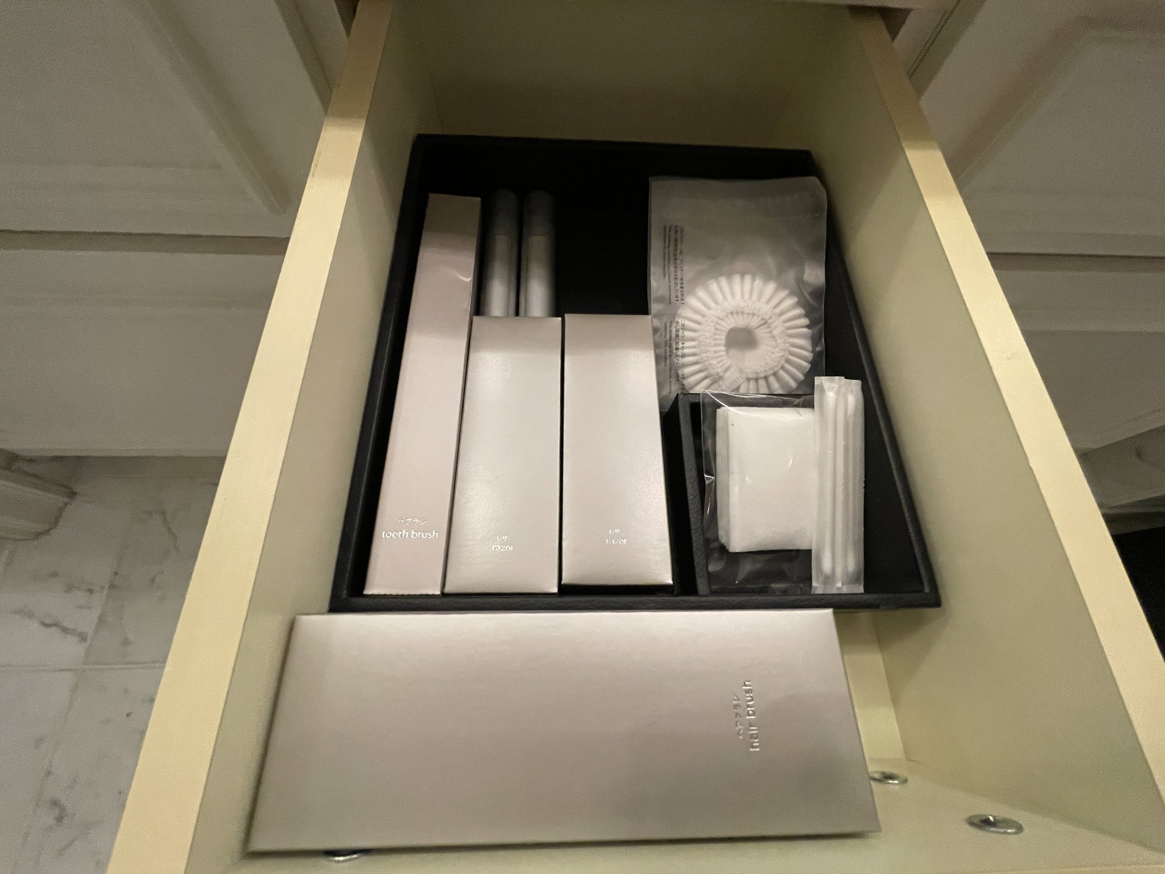 Amenities neatly arranged in a drawer.