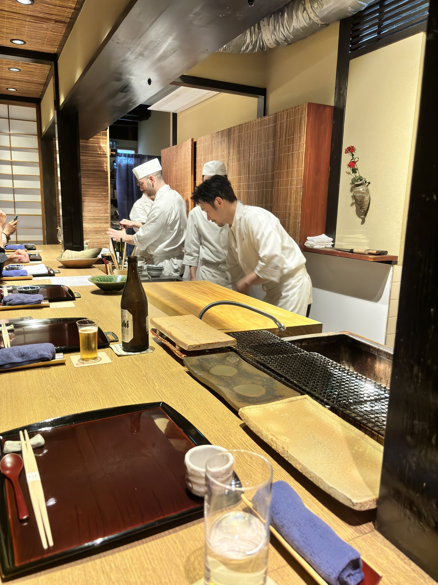 Cooks at work along the counter.