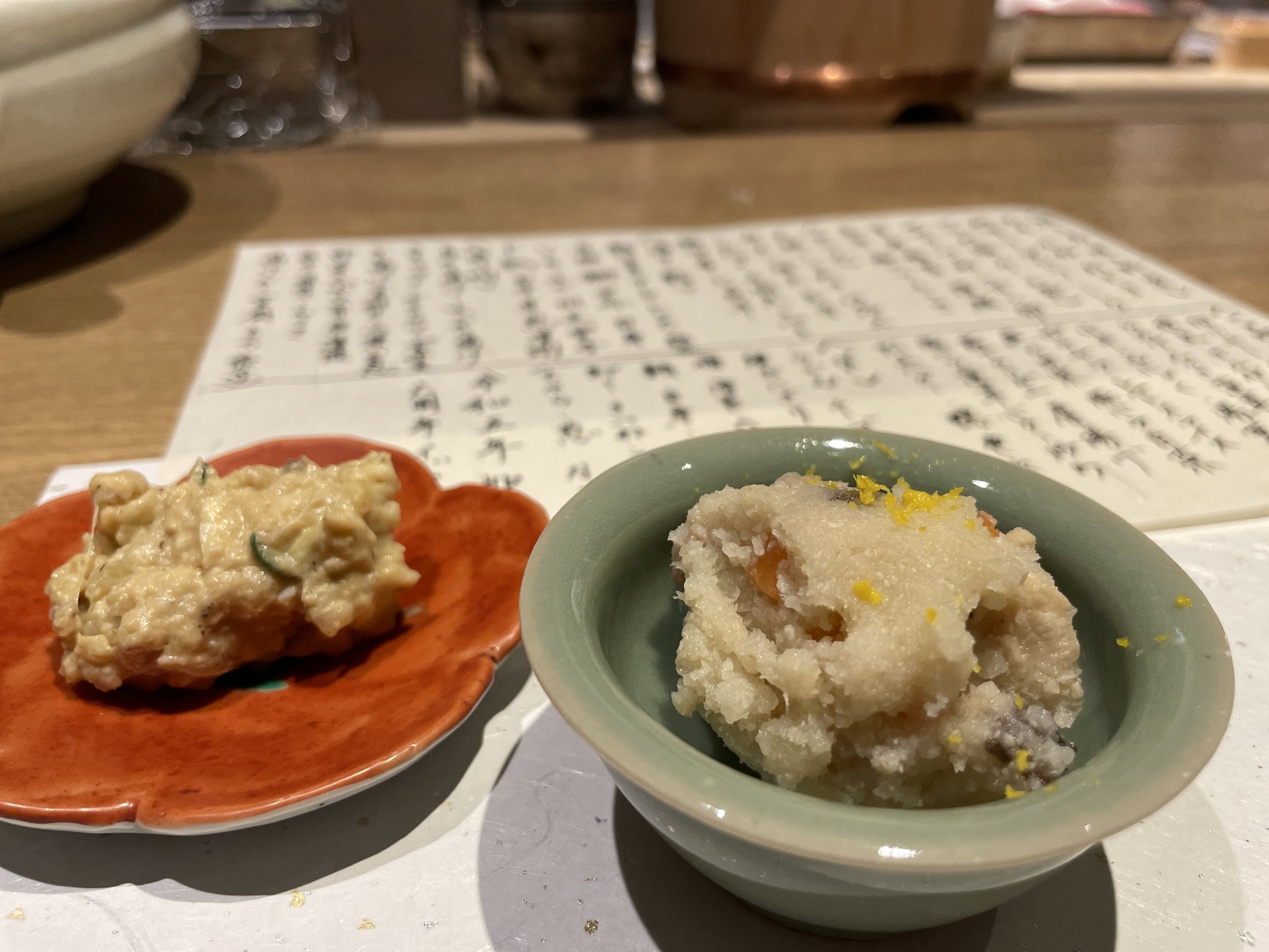 Two small dishes: an okara salad and a potato salad.
