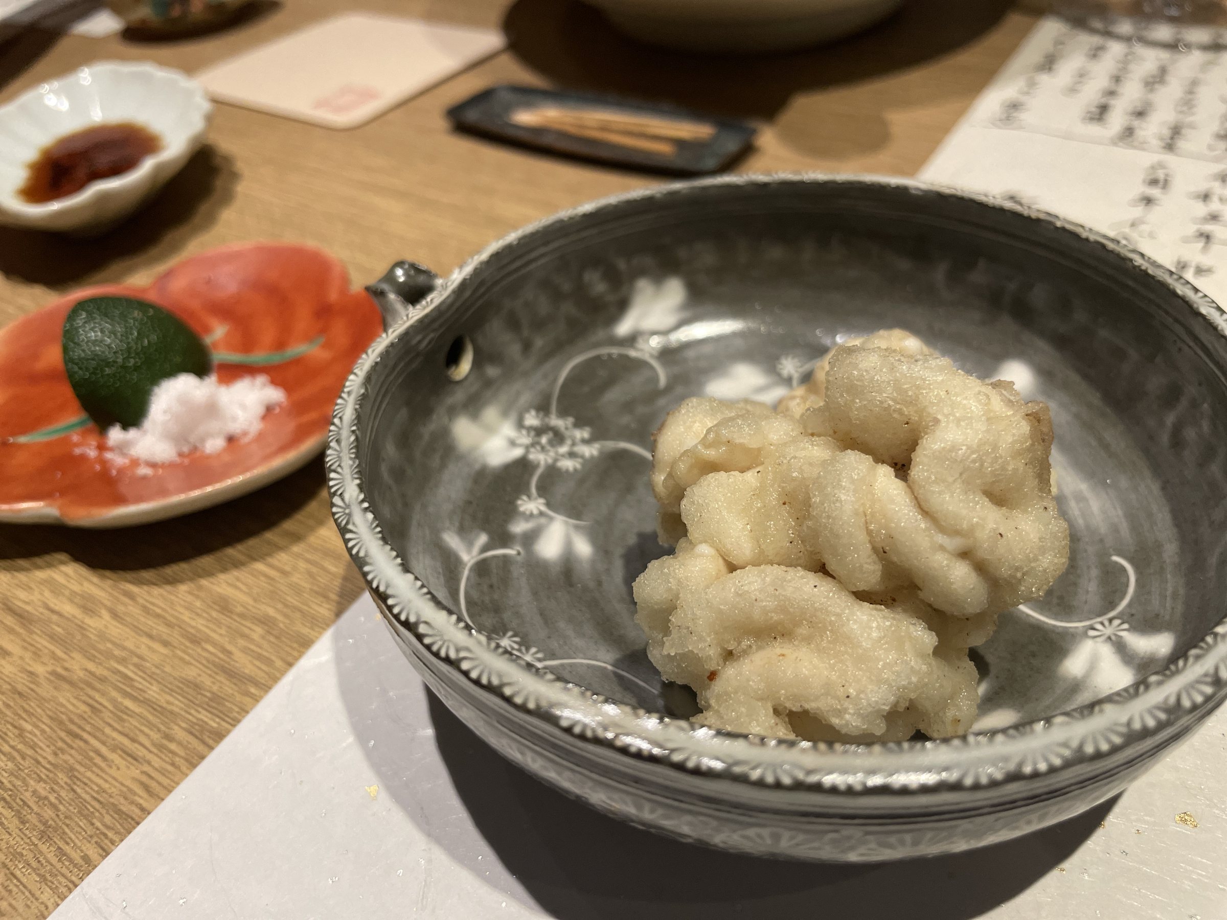 Lightly fried shirako in a patterned bowl.