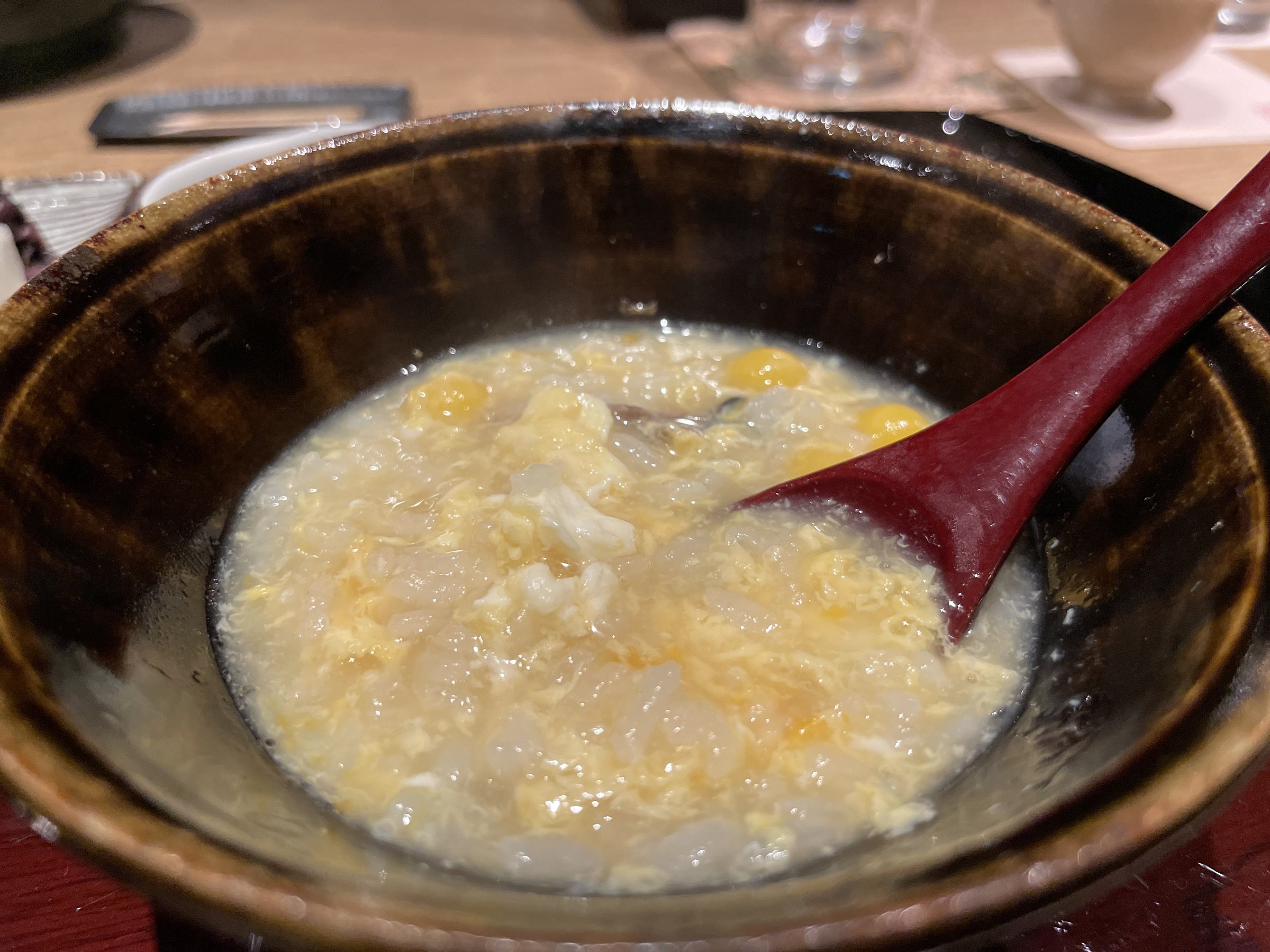 Fugu porridge with softly set egg.