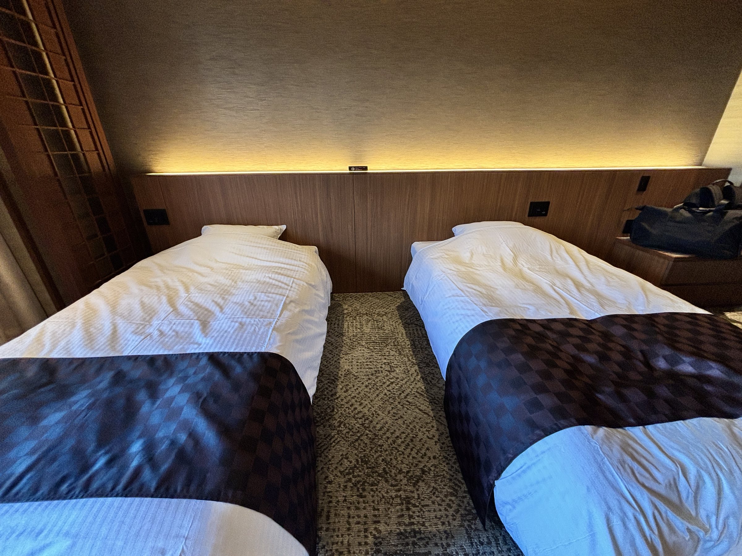 The beds under soft indirect lighting.