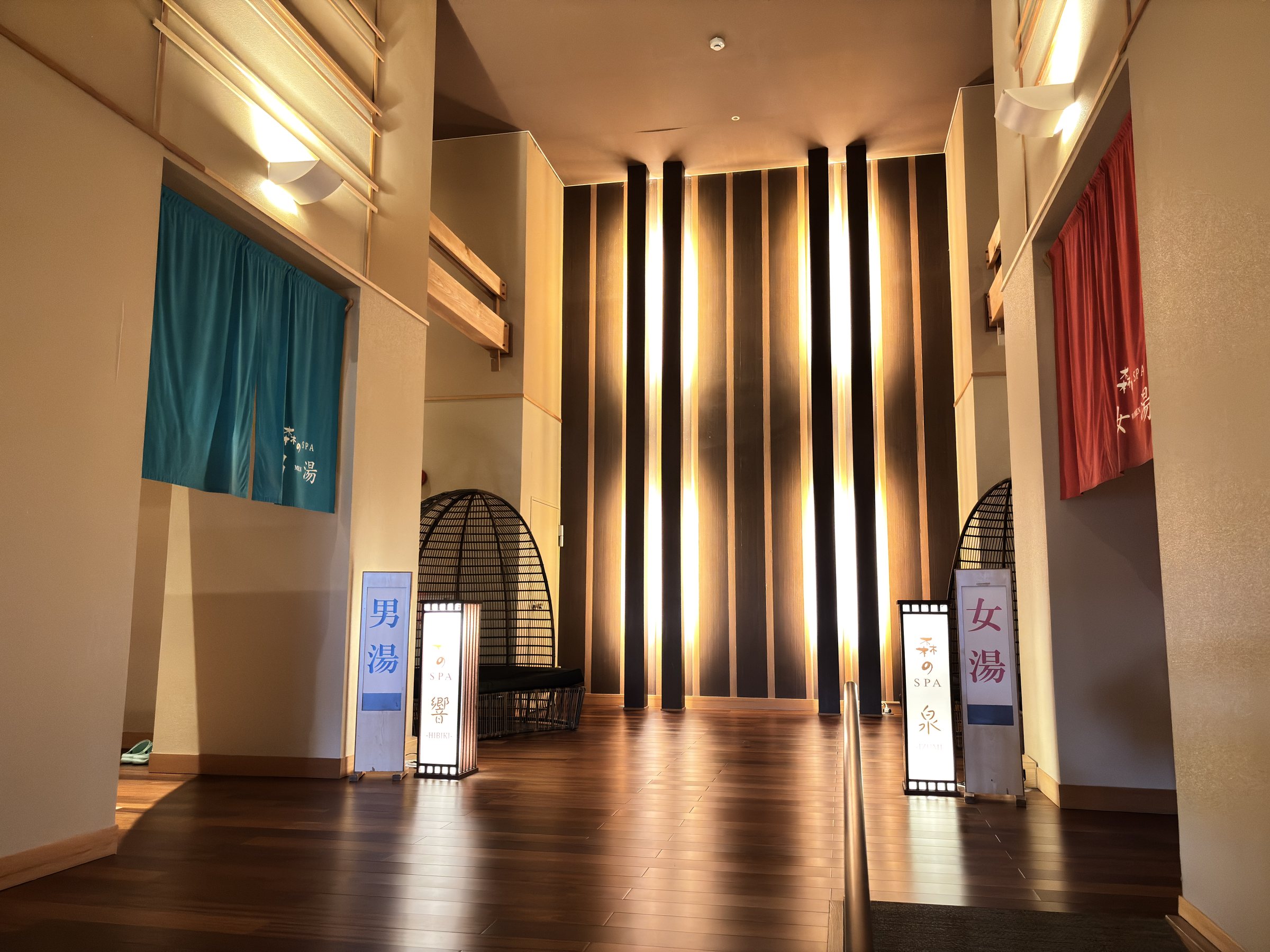 The bath entrances, with blue and red curtains and a hanging chair.