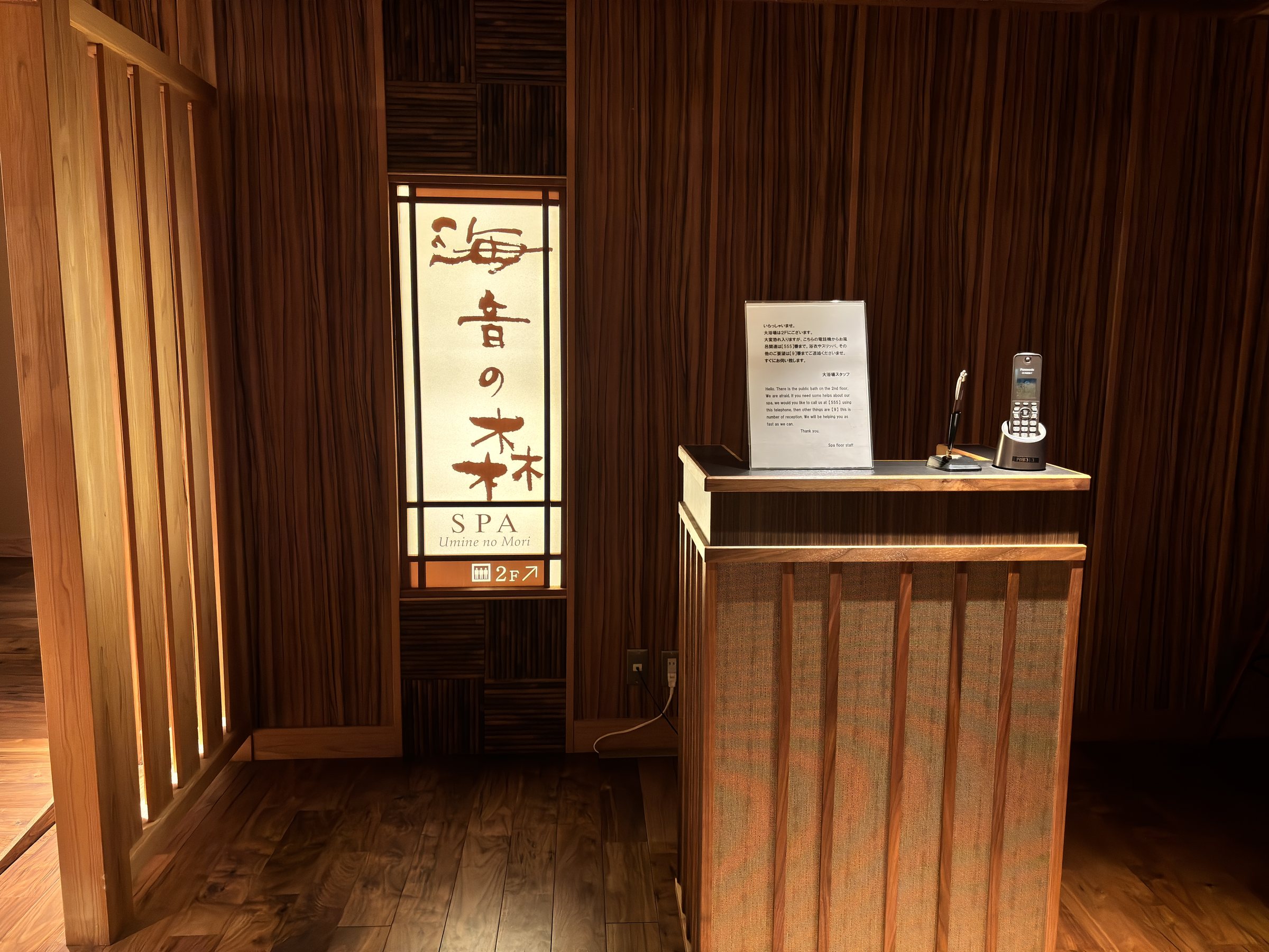 A wooden reception desk at the spa entrance.