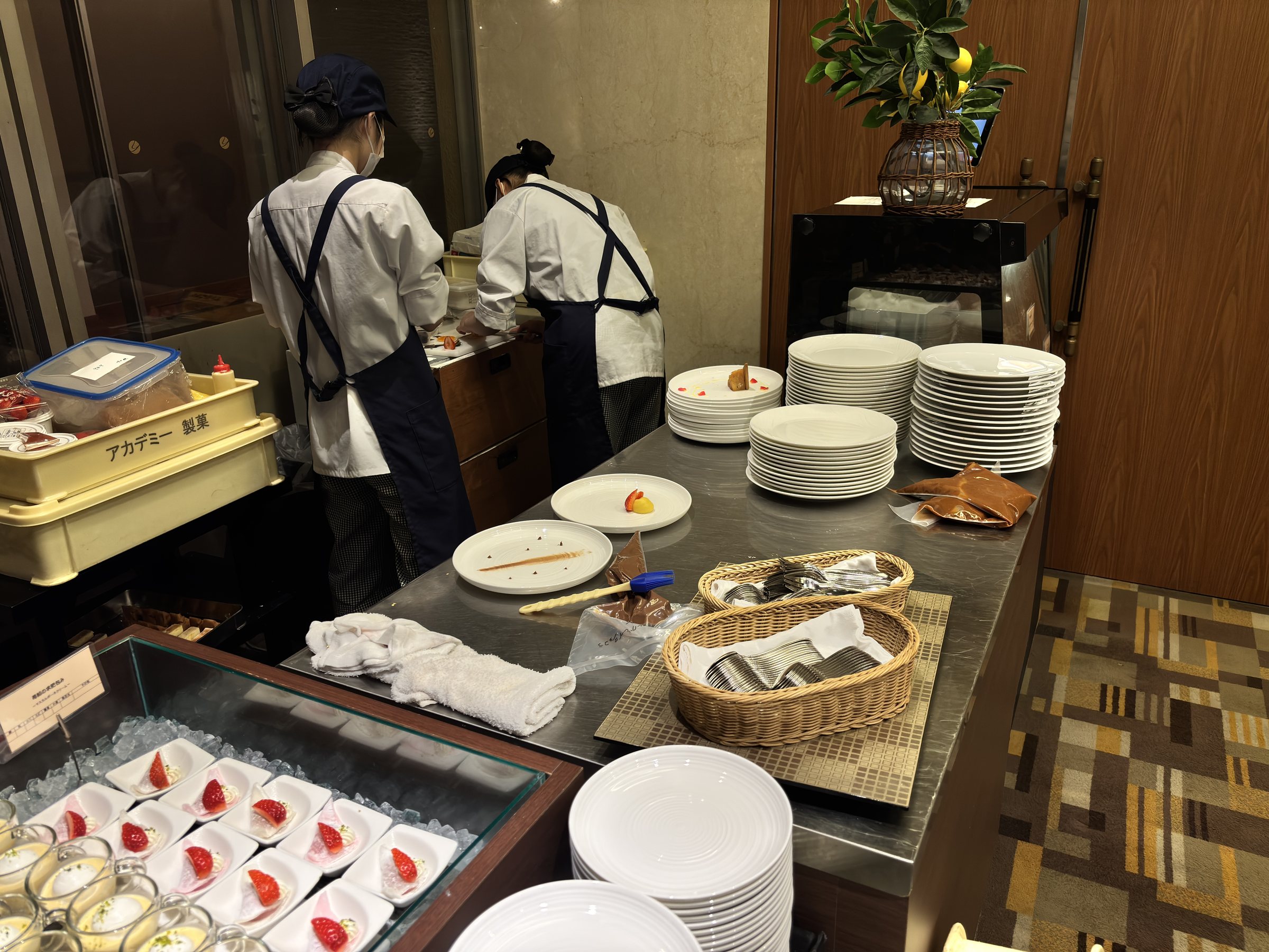 Students plating desserts to order.