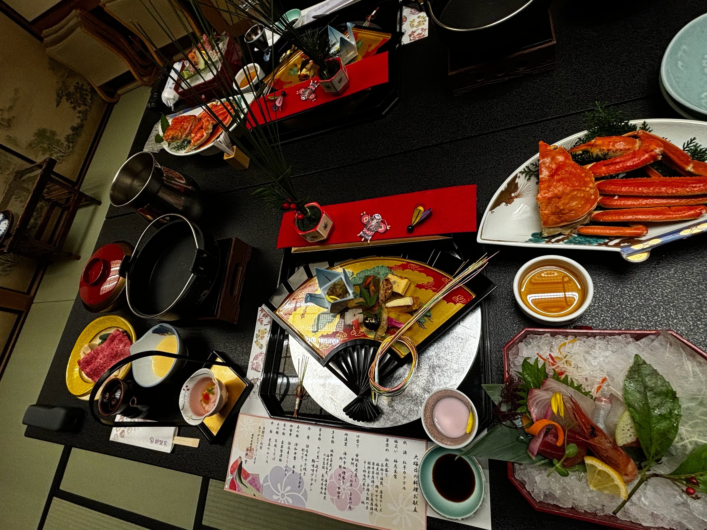 The full dinner spread, with snow crab, sashimi and wagyu among the dishes.